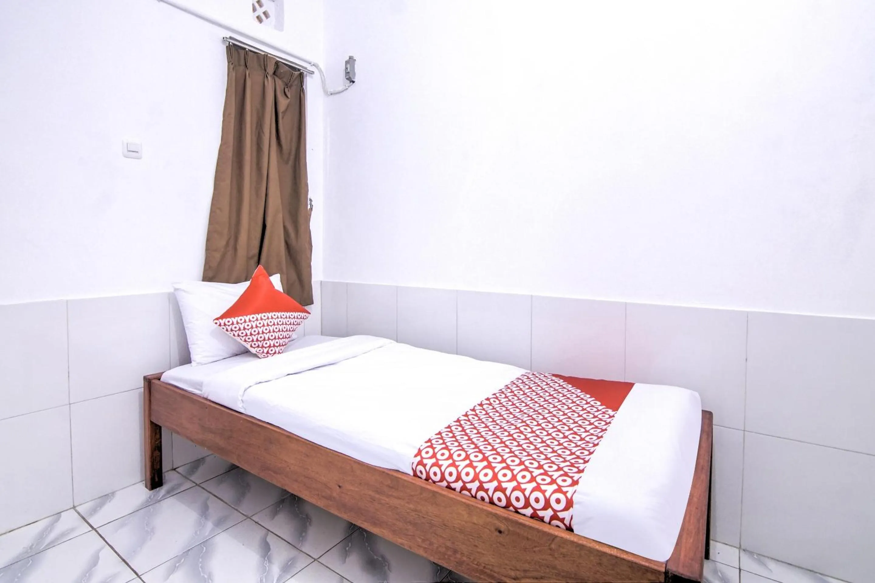 Bedroom in OYO 3317 Maju Jaya Homestay Syariah