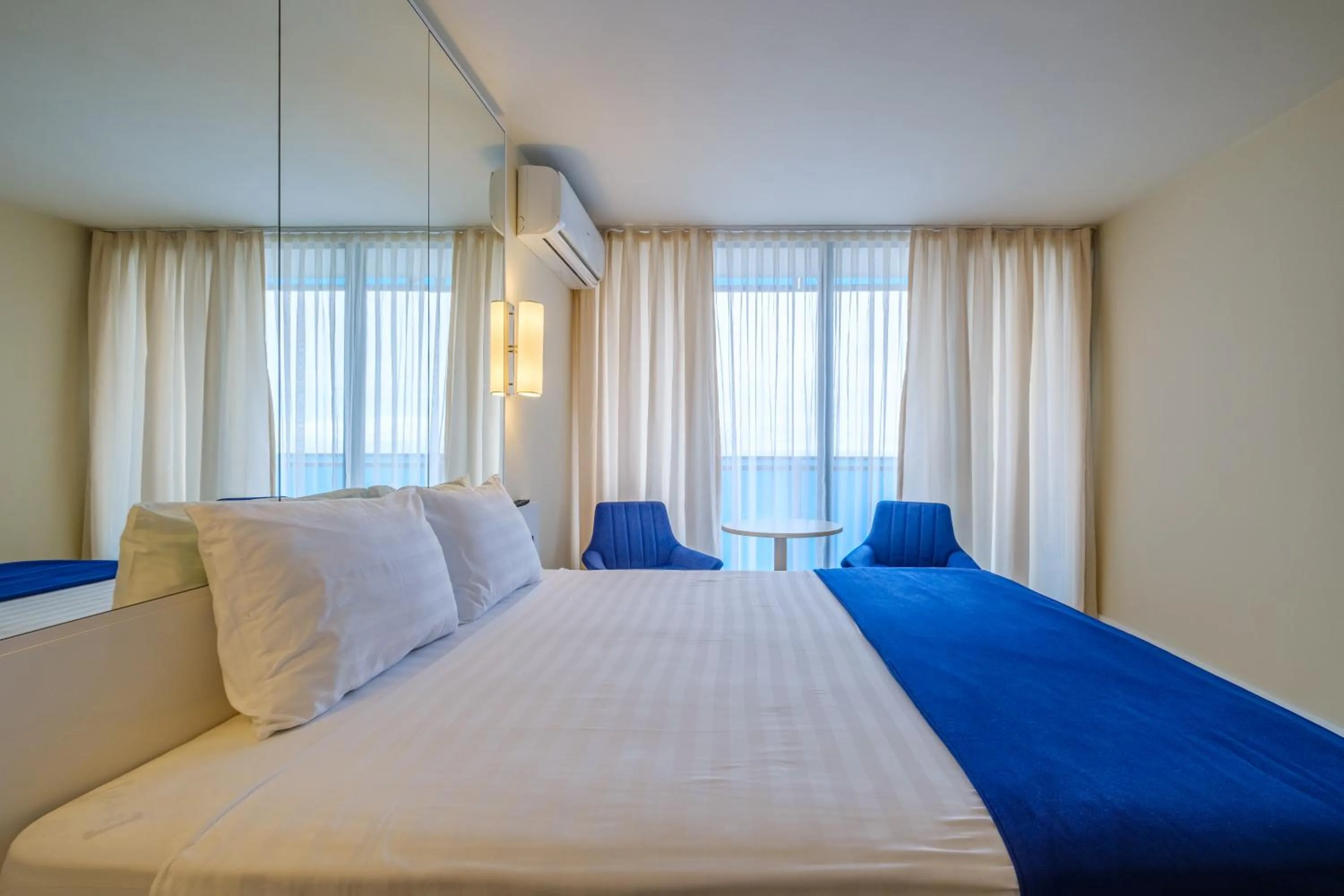 View (from property/room), Bed in Orbi City Hotel Official