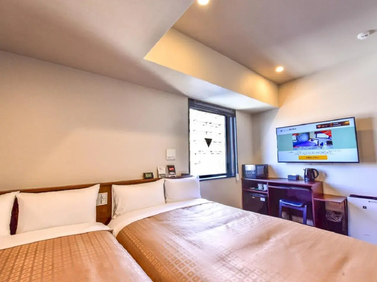 Bed in HOTEL LiVEMAX Hakata Nakasu Bed in HOTEL LiVEMAX Hakata Nakasu