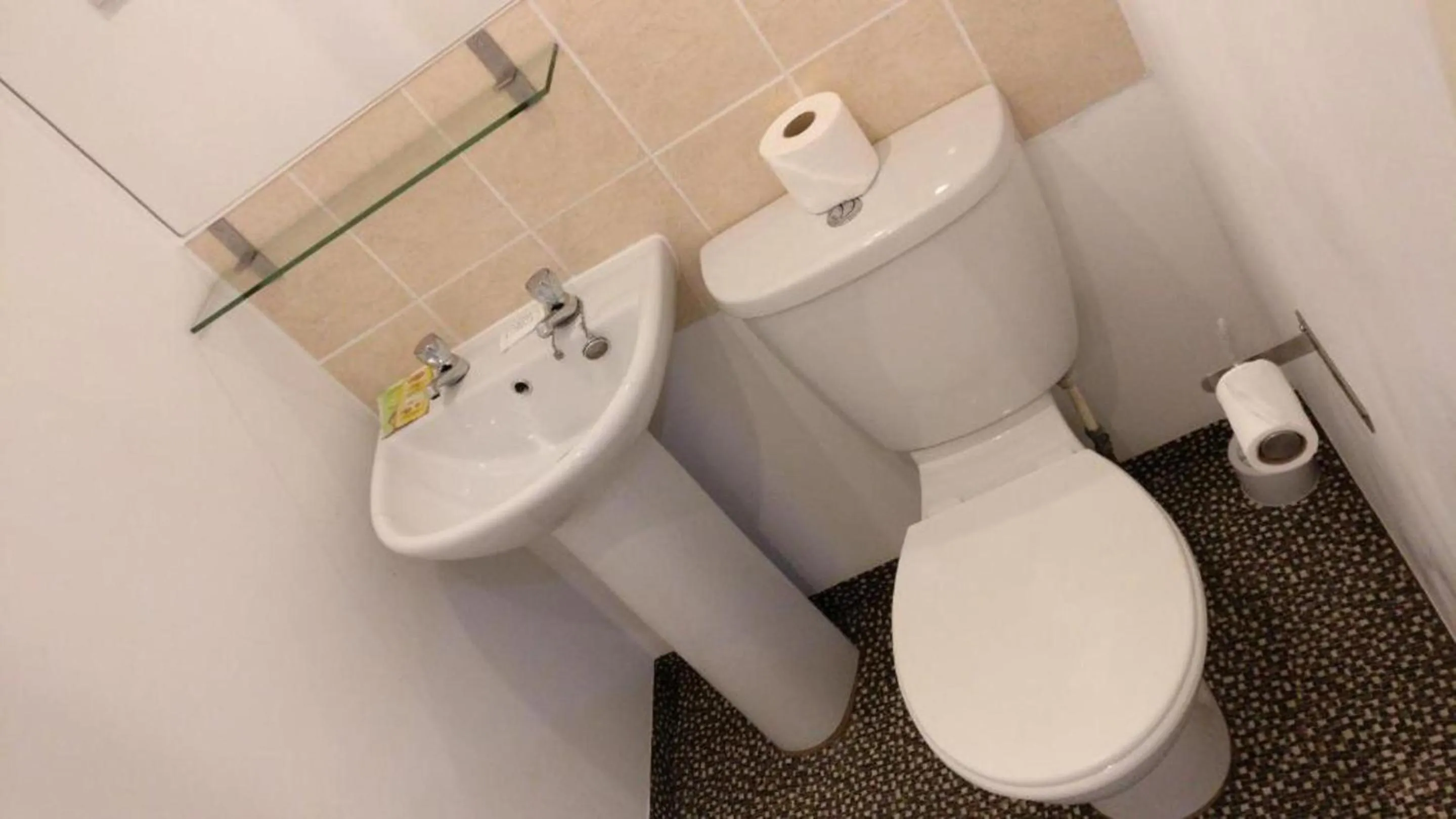 Bathroom in OYO Wave Crest Hotel