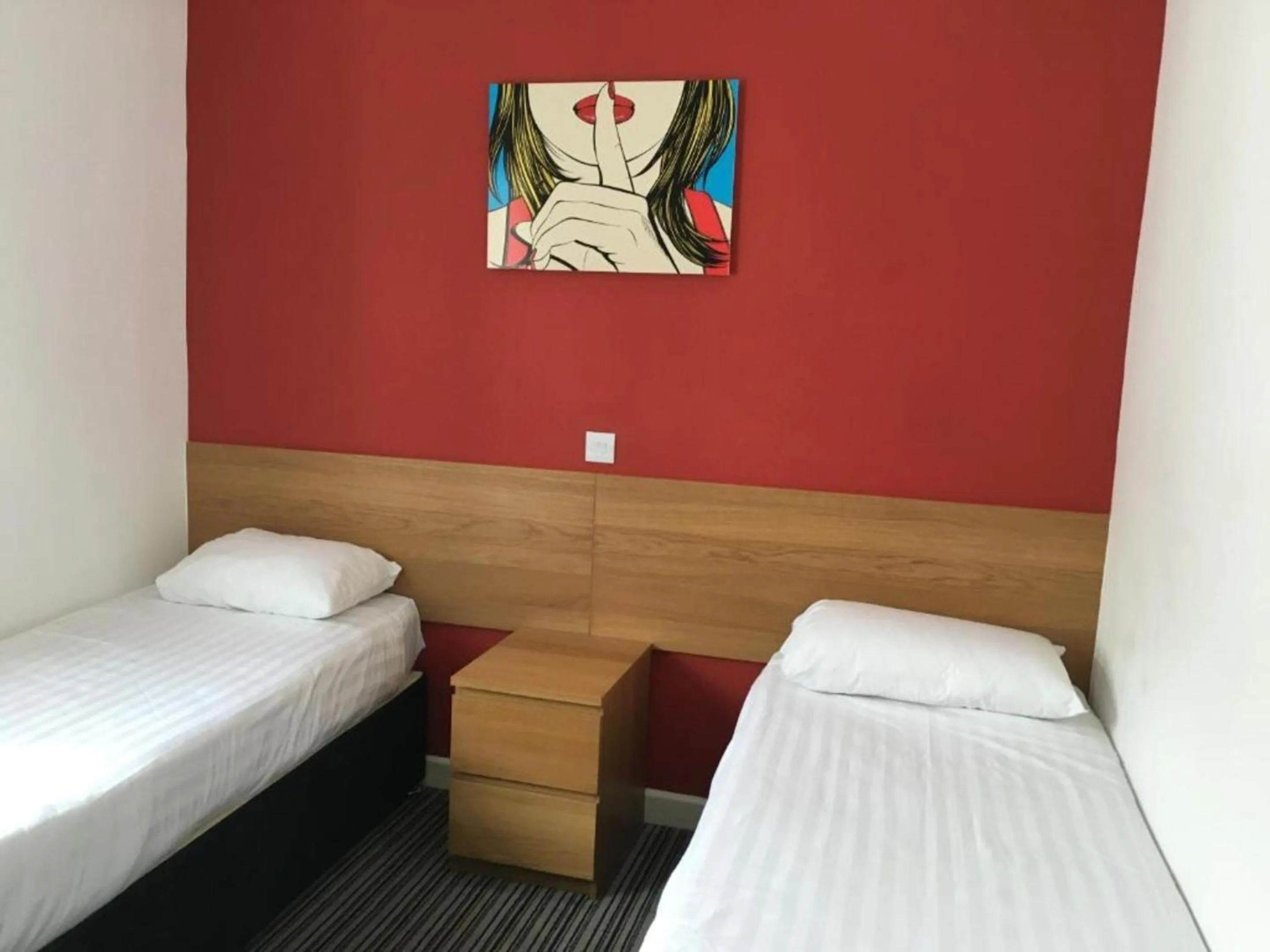 Bed in OYO Wave Crest Hotel