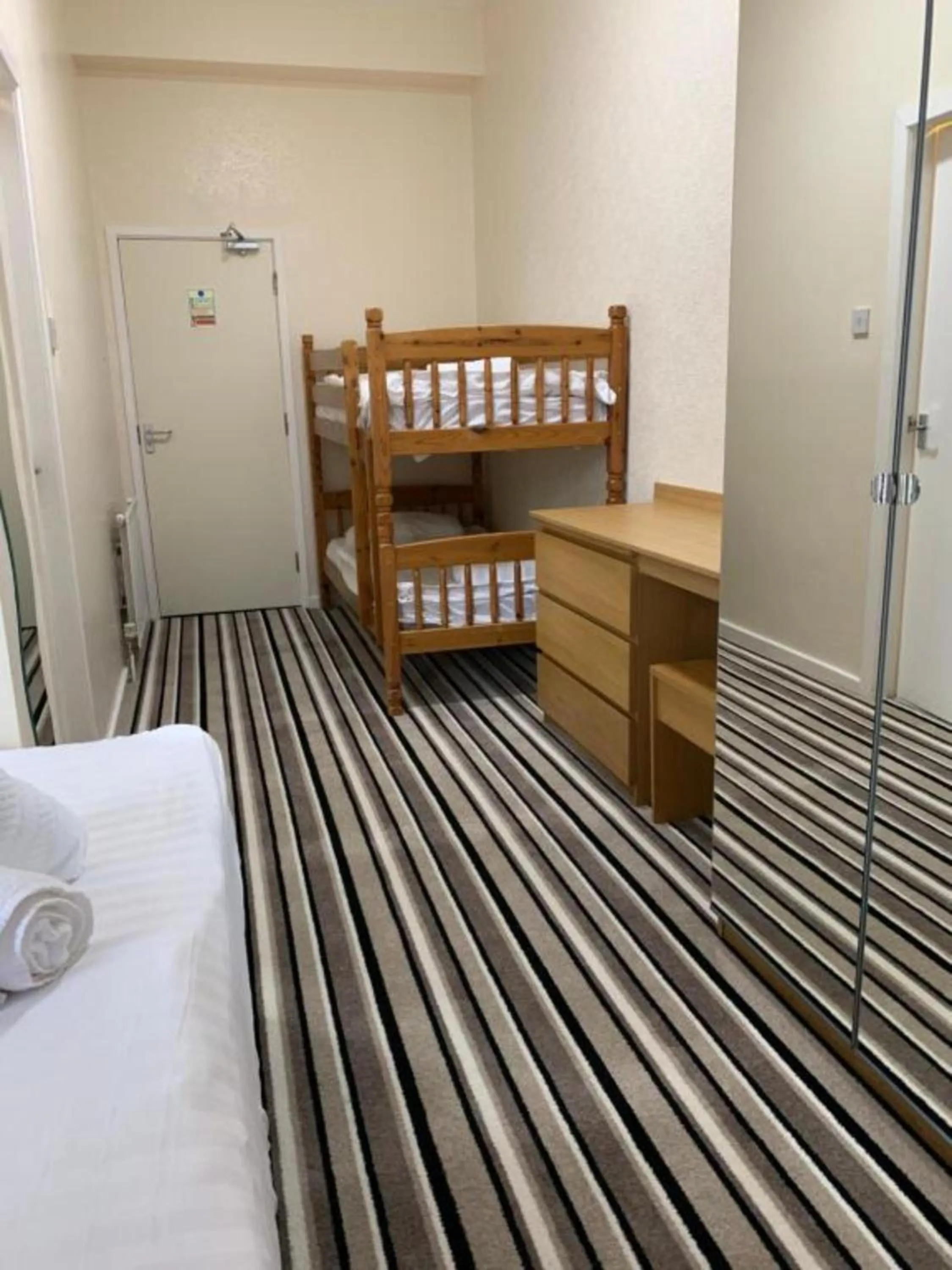 Photo of the whole room, Bed in OYO Wave Crest Hotel