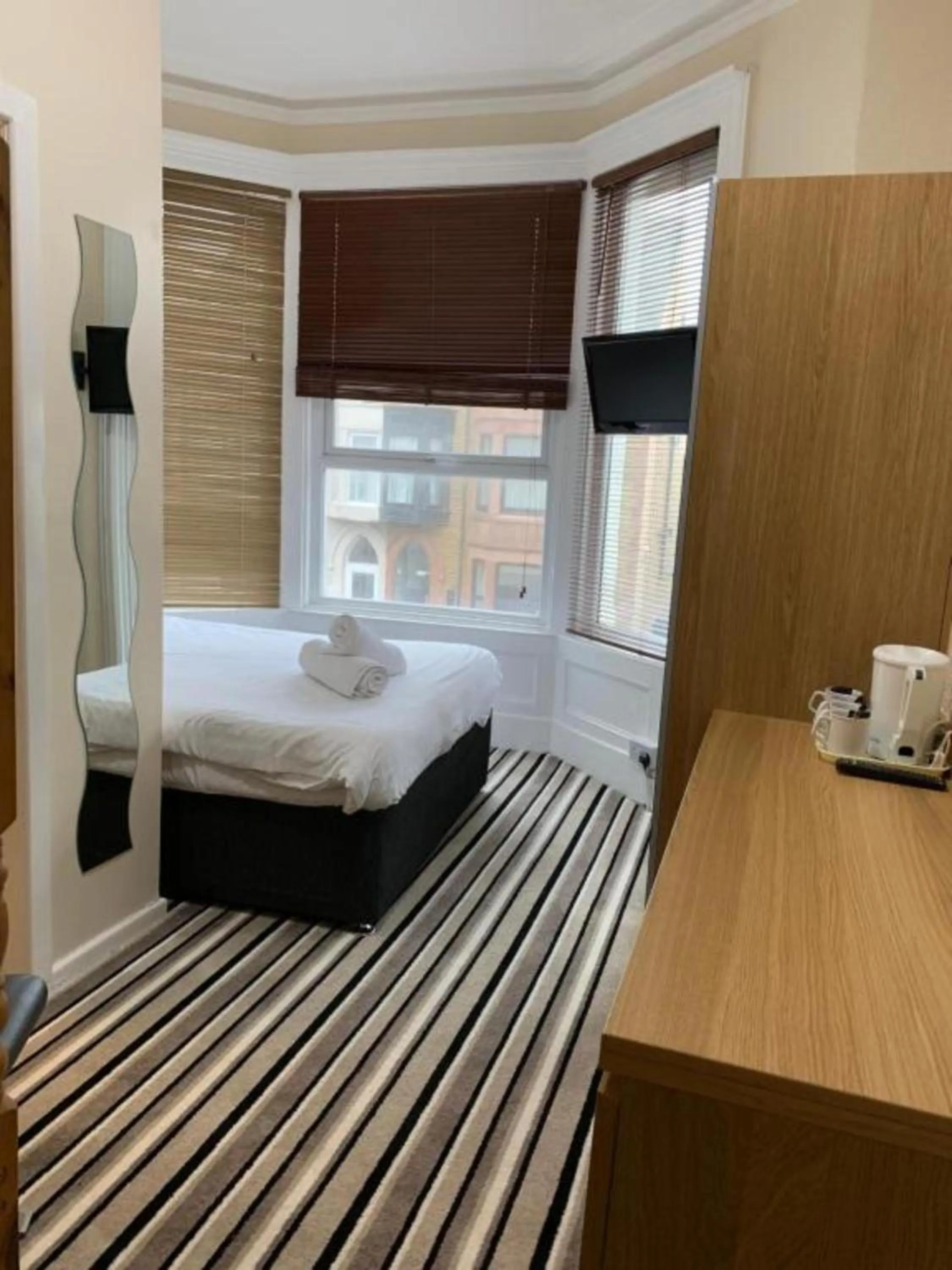 Photo of the whole room, Bed in OYO Wave Crest Hotel