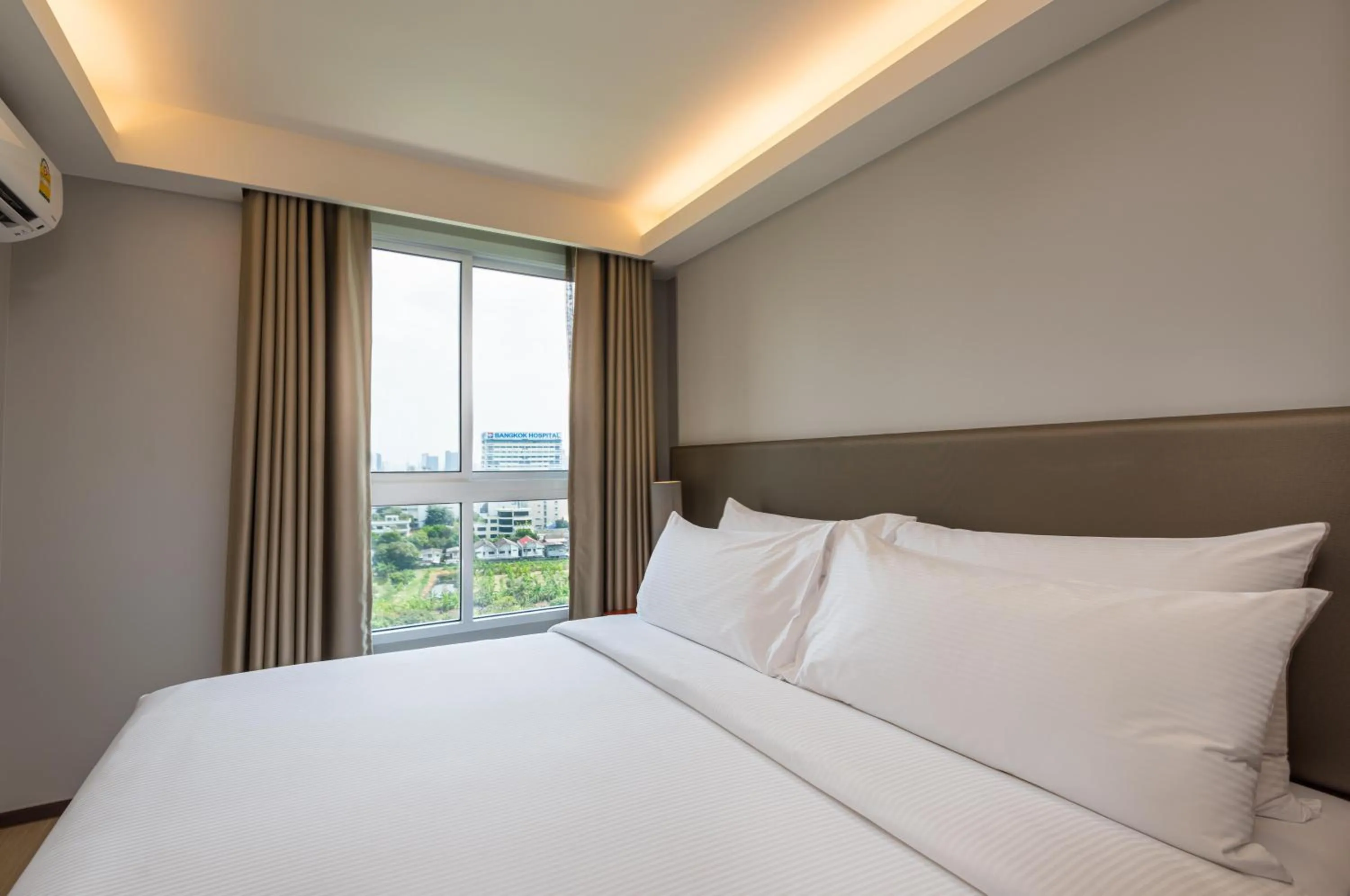 Bed in Maitria Hotel Rama 9 Bangkok - A Chatrium Collection