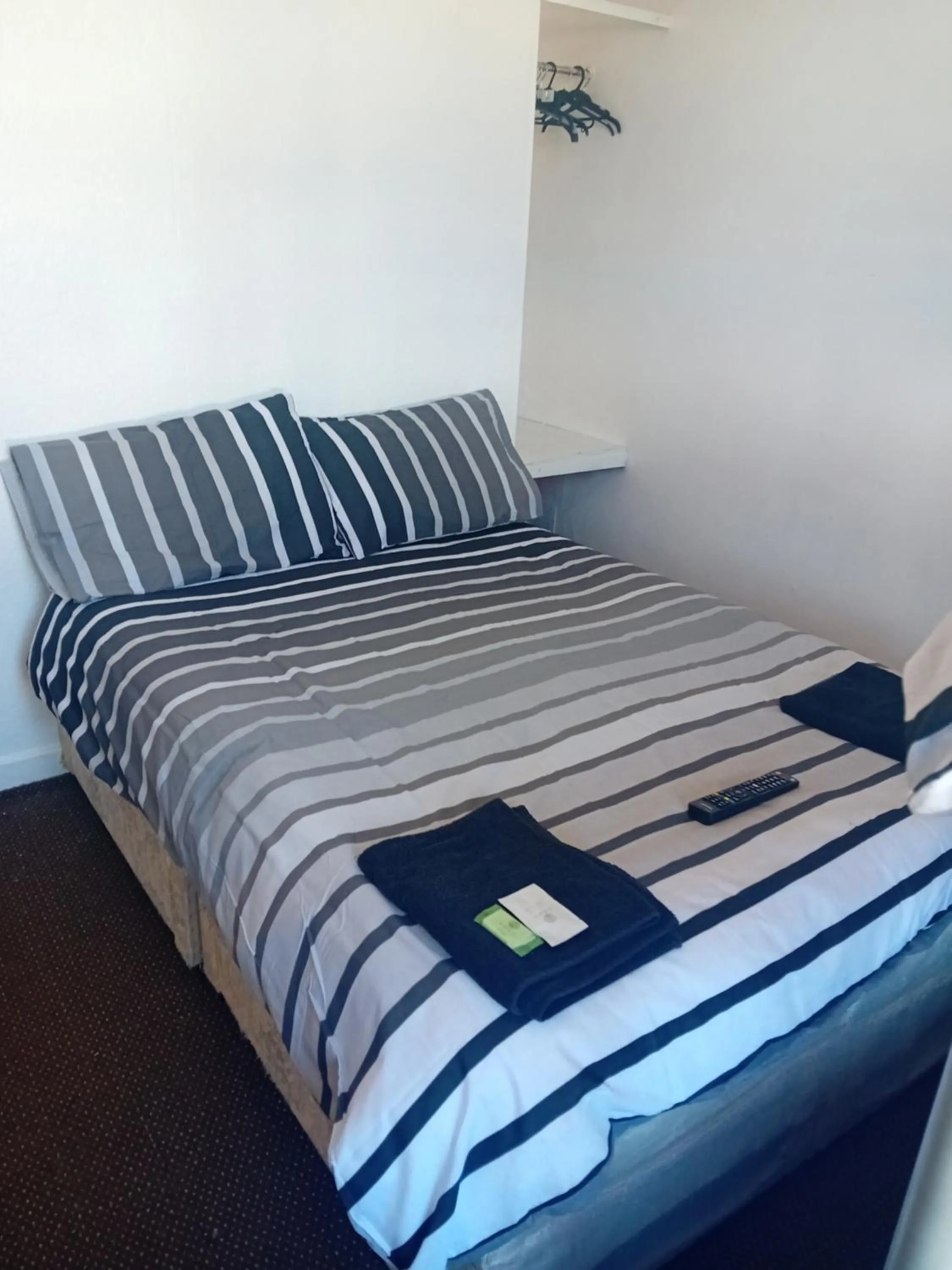 Bed in MyRoomz New Discovery Hotel