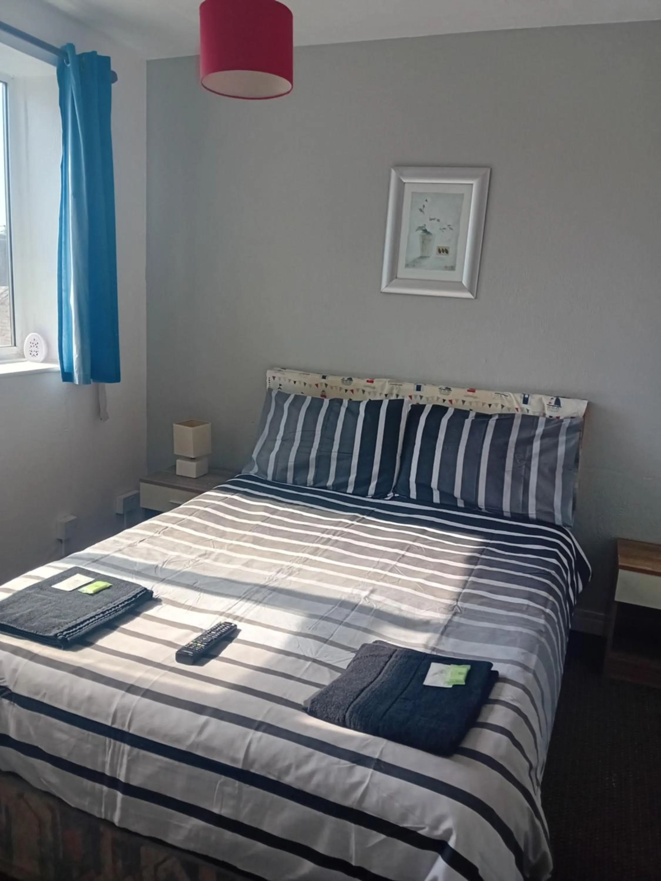 Bed in MyRoomz New Discovery Hotel