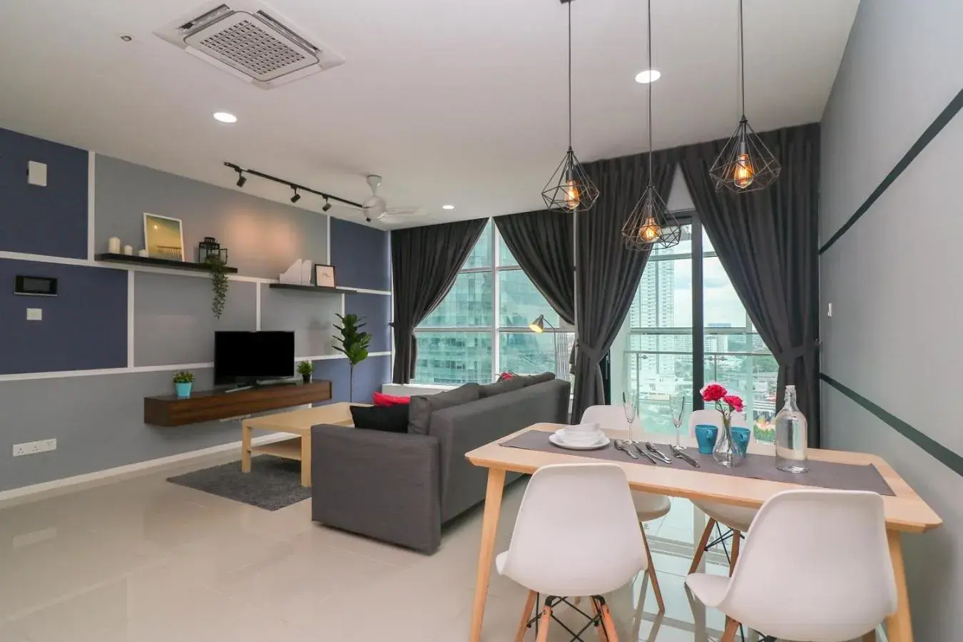 Living room in Suasana Residence by Nest Home Living room in Suasana Residence by Nest Home