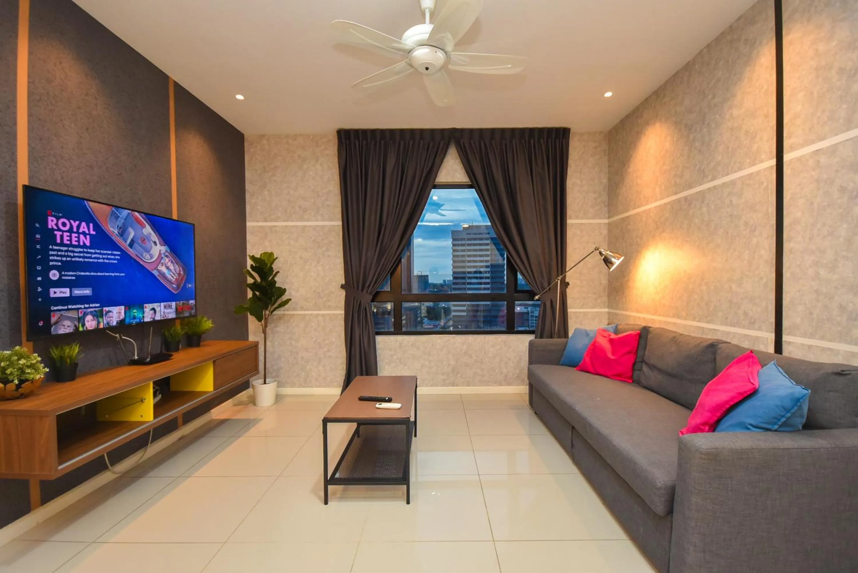 Living room in Suasana Residence by Nest Home