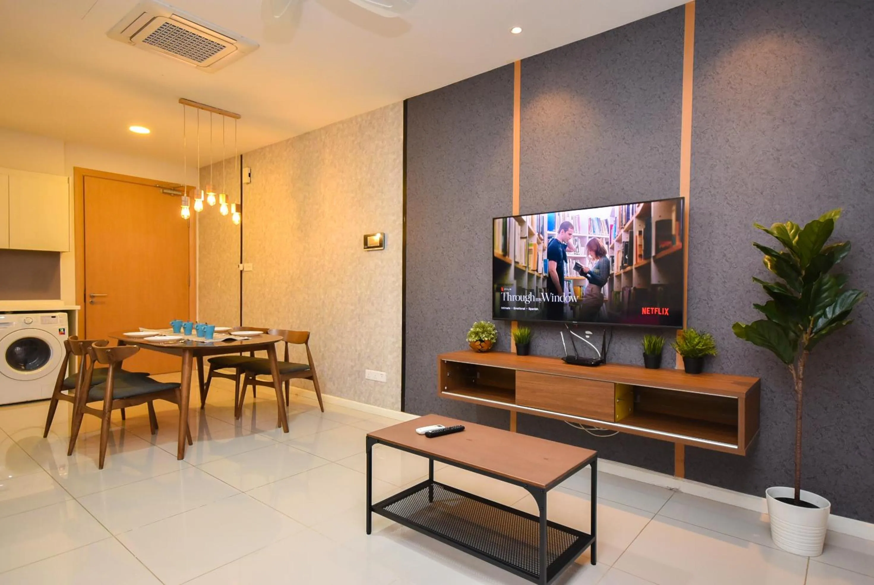 Living room in Suasana Residence by Nest Home