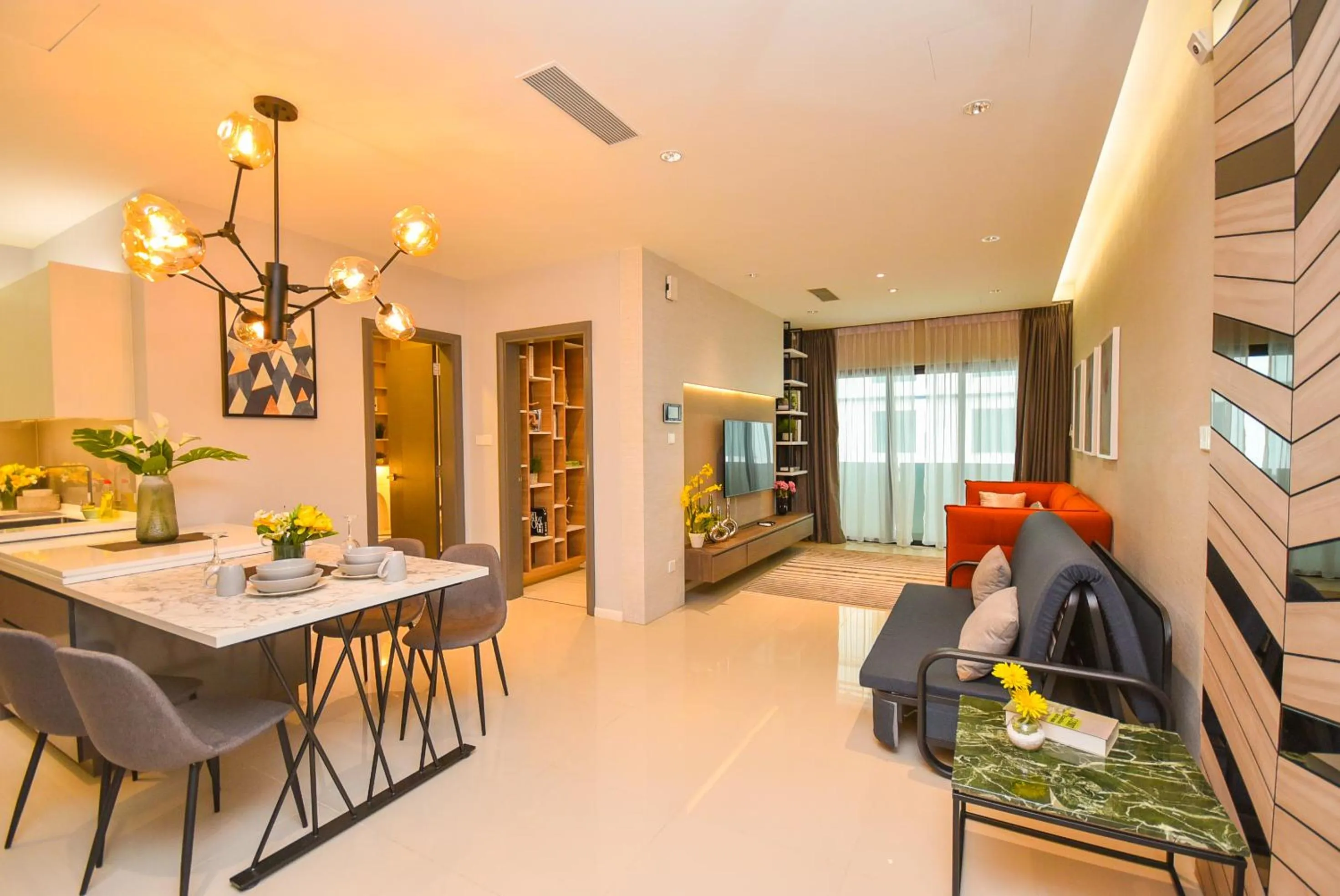 Living room in Suasana Residence by Nest Home