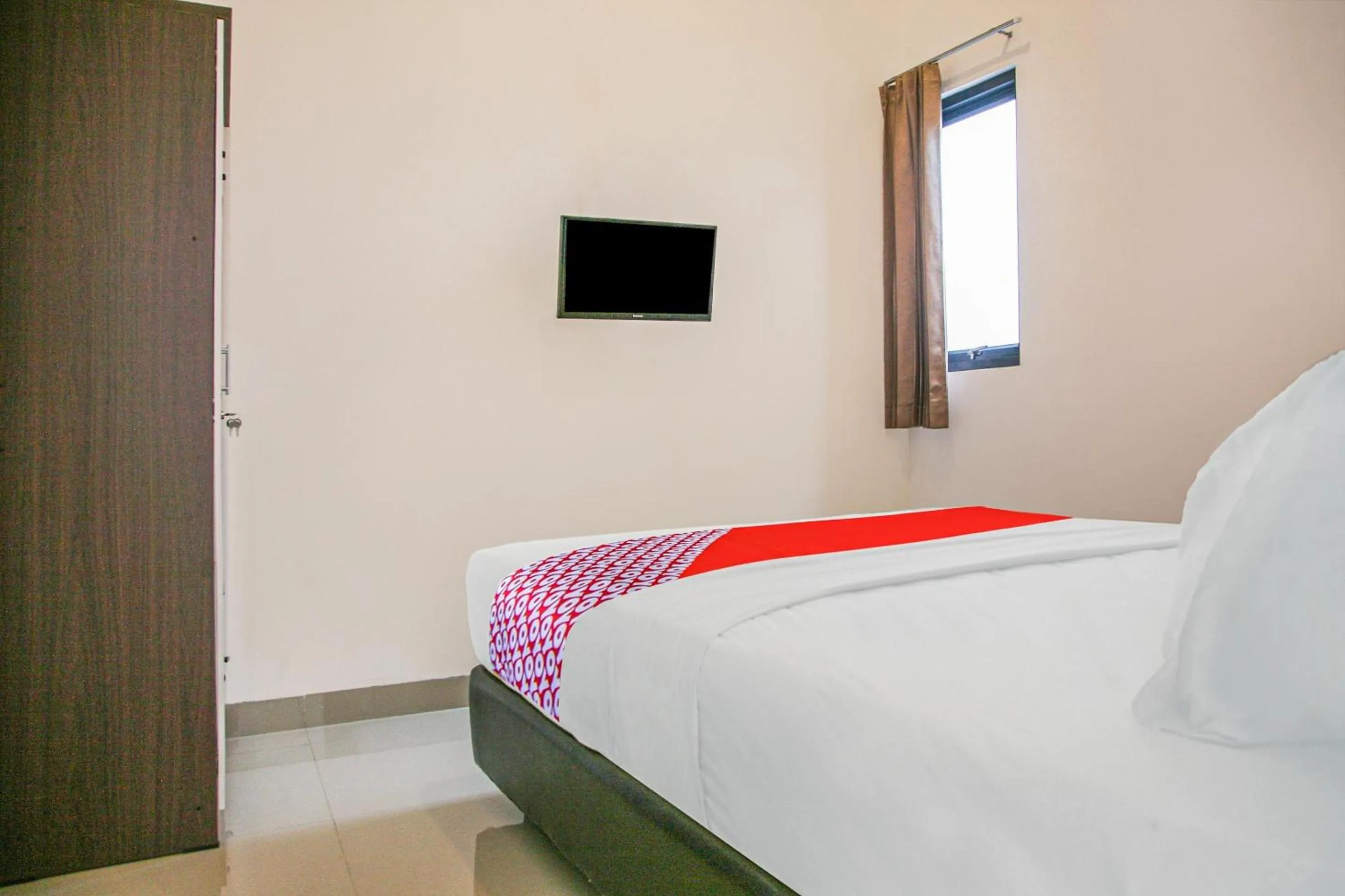 Bedroom in Hotel O Pasir Padi Inn Syariah