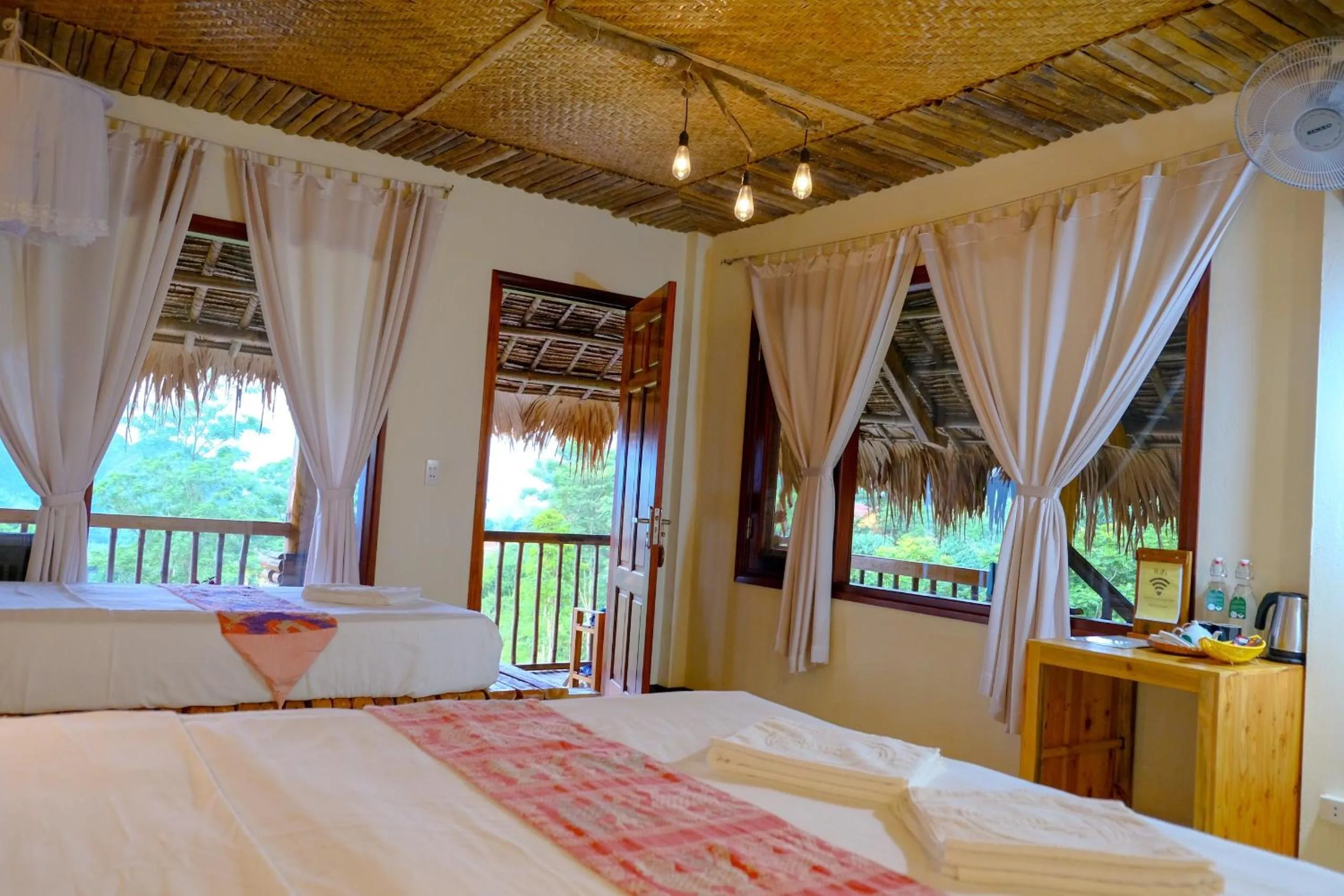 Bed in Pu Luong Jungle Lodge