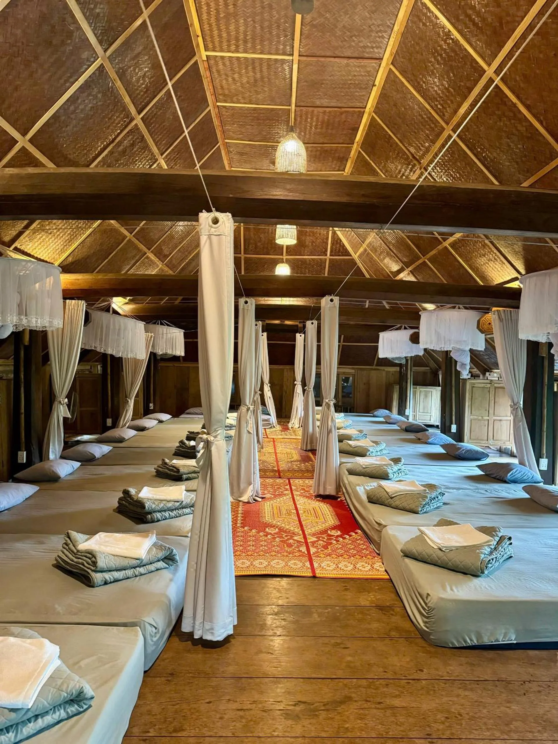 Bed in Pu Luong Jungle Lodge