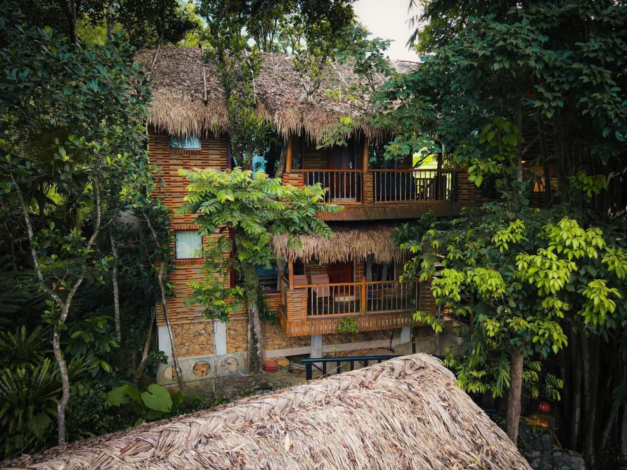 Triple Room with Balcony and Garden View in Pu Luong Jungle Lodge Triple Room with Balcony and Garden View in Pu Luong Jungle Lodge
