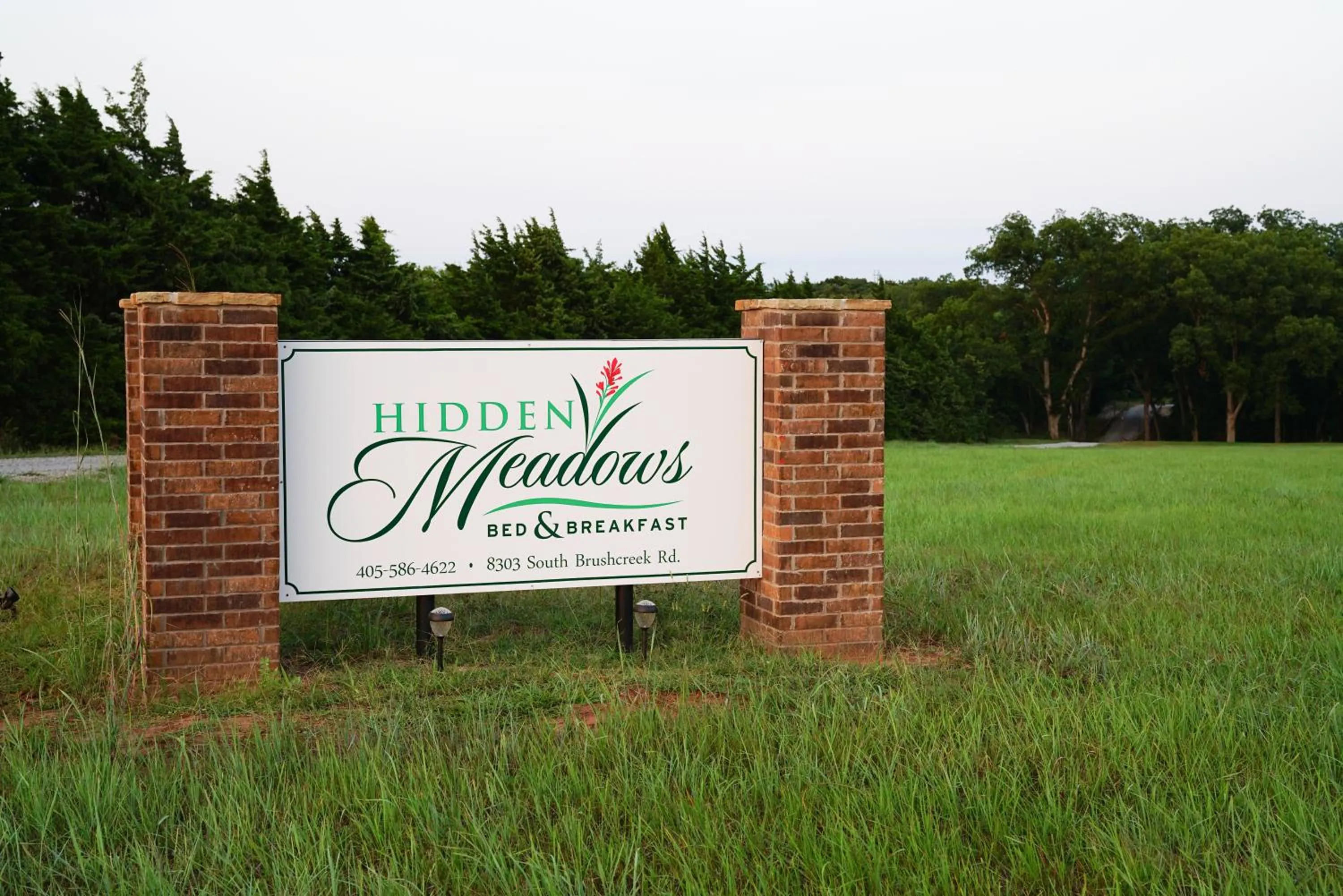 Property logo or sign in Hidden Meadows Bed and Breakfast