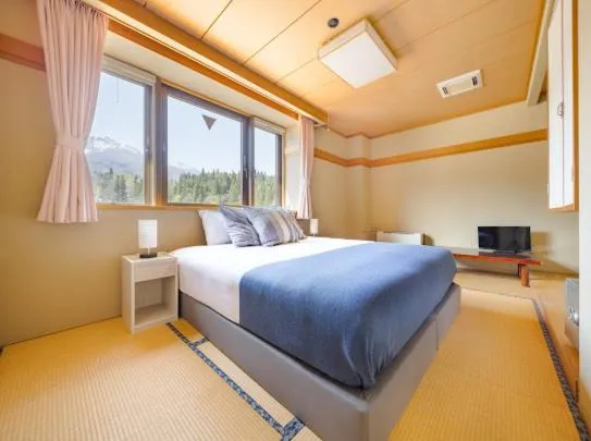 Bed in Red Fox Lodge Myoko