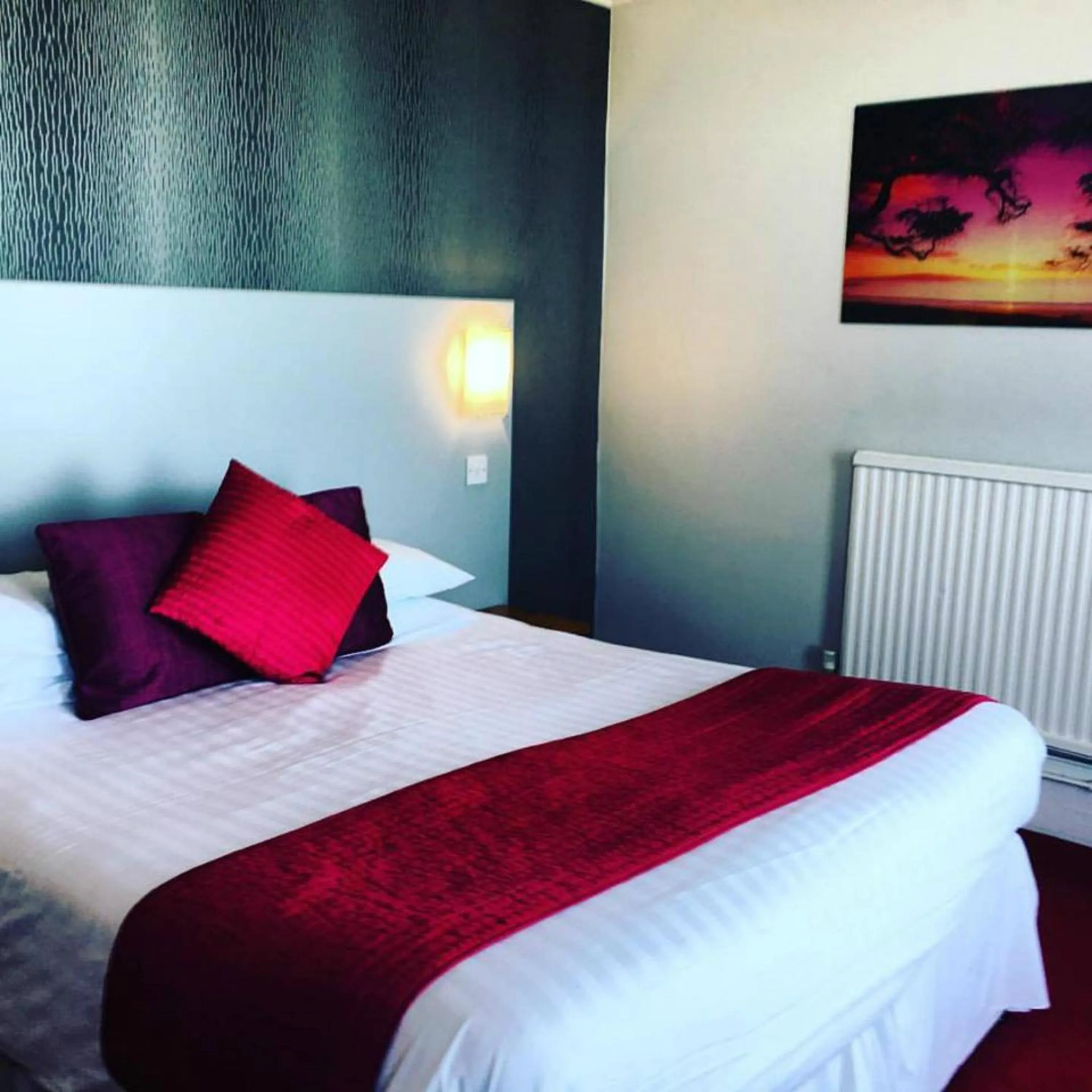 Bedroom in Harrow Lodge Hotel