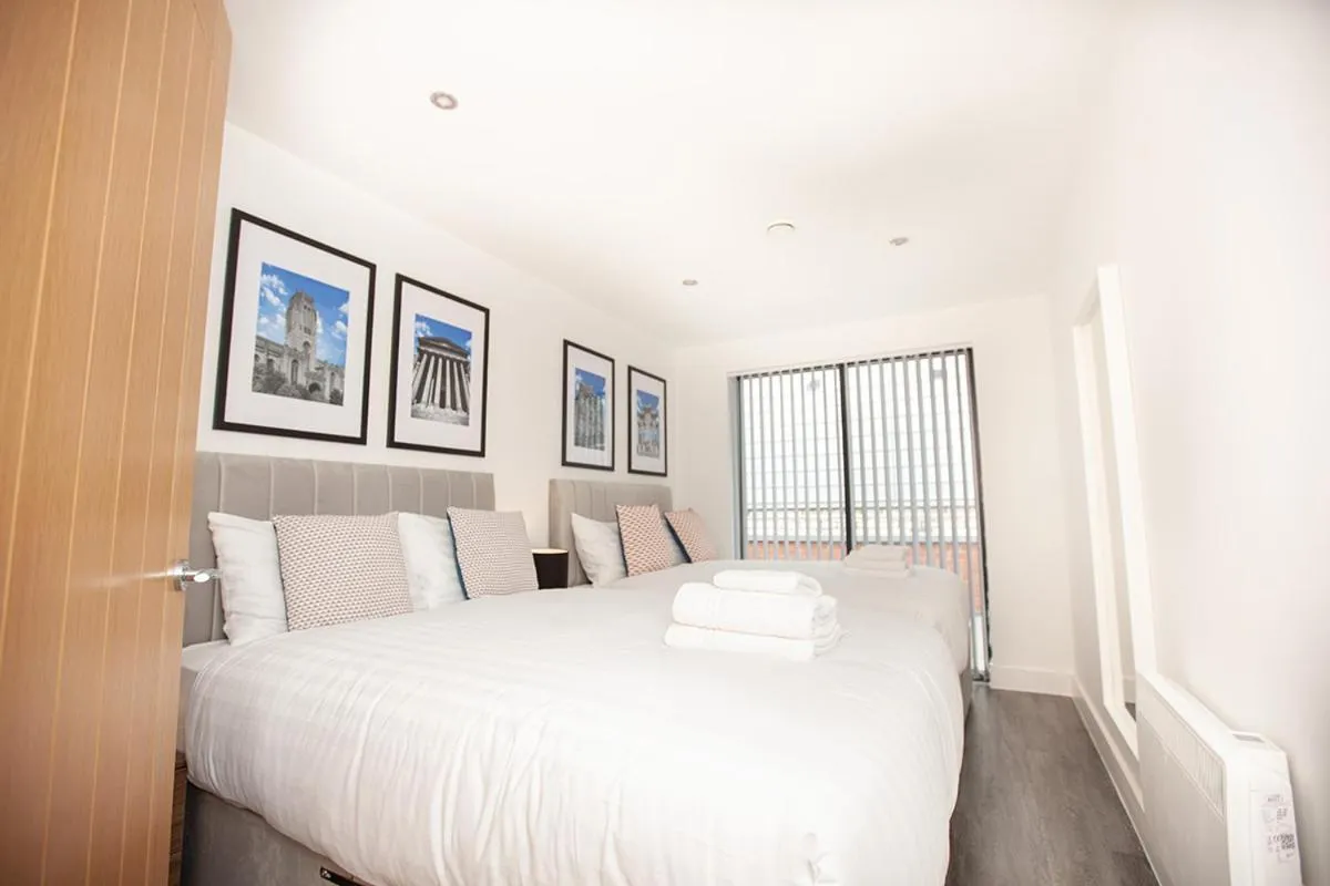 Bed in SGT Peppers Mathew Street Apartments By Happy Days