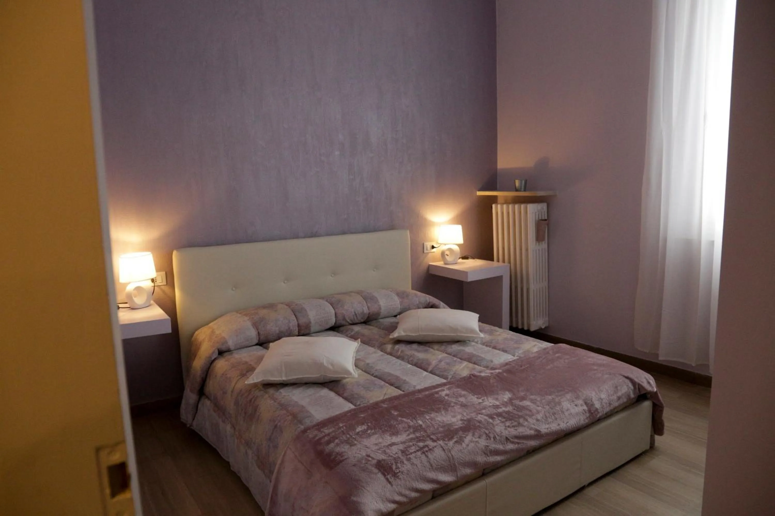 Bed in Ad Astra Rooms