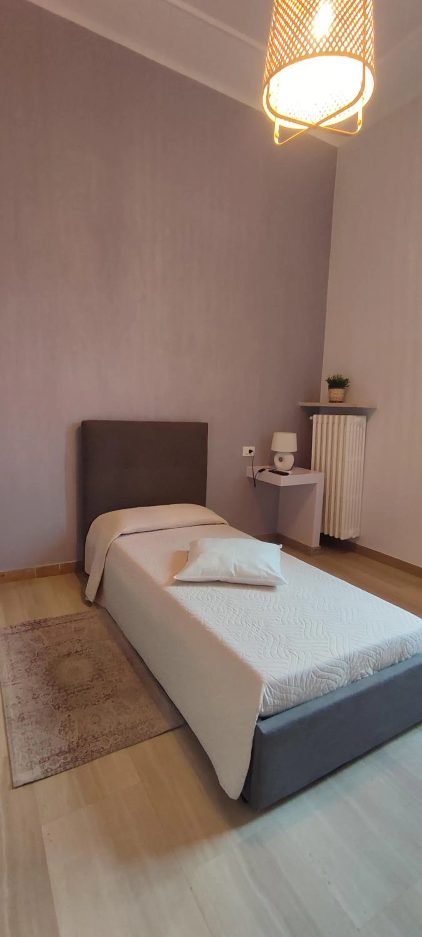 Bed in Ad Astra Rooms