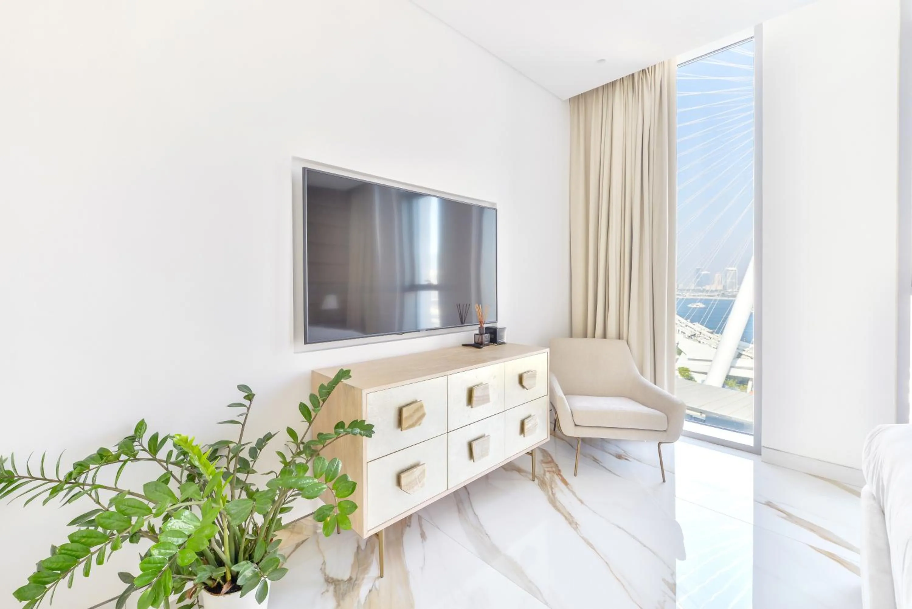 TV and multimedia in Lavish & Equipped oceanfront 2 BR facing Ain Dubai