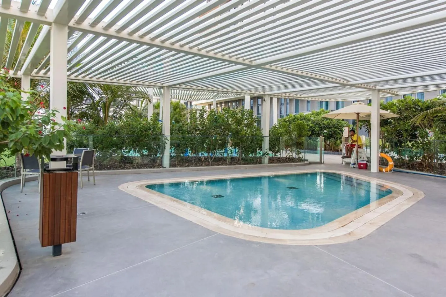 Swimming pool in Lavish & Equipped oceanfront 2 BR facing Ain Dubai