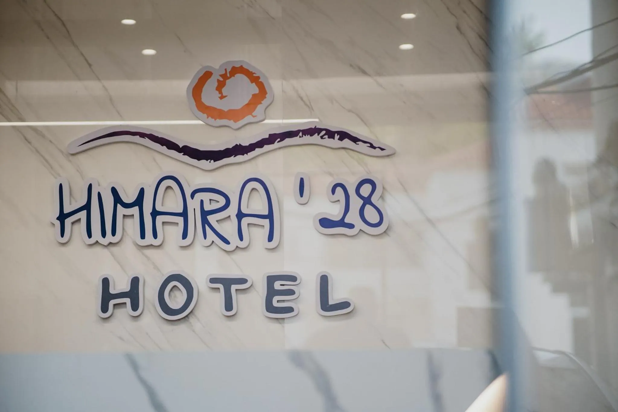 Property logo or sign in Himara 28 Hotel
