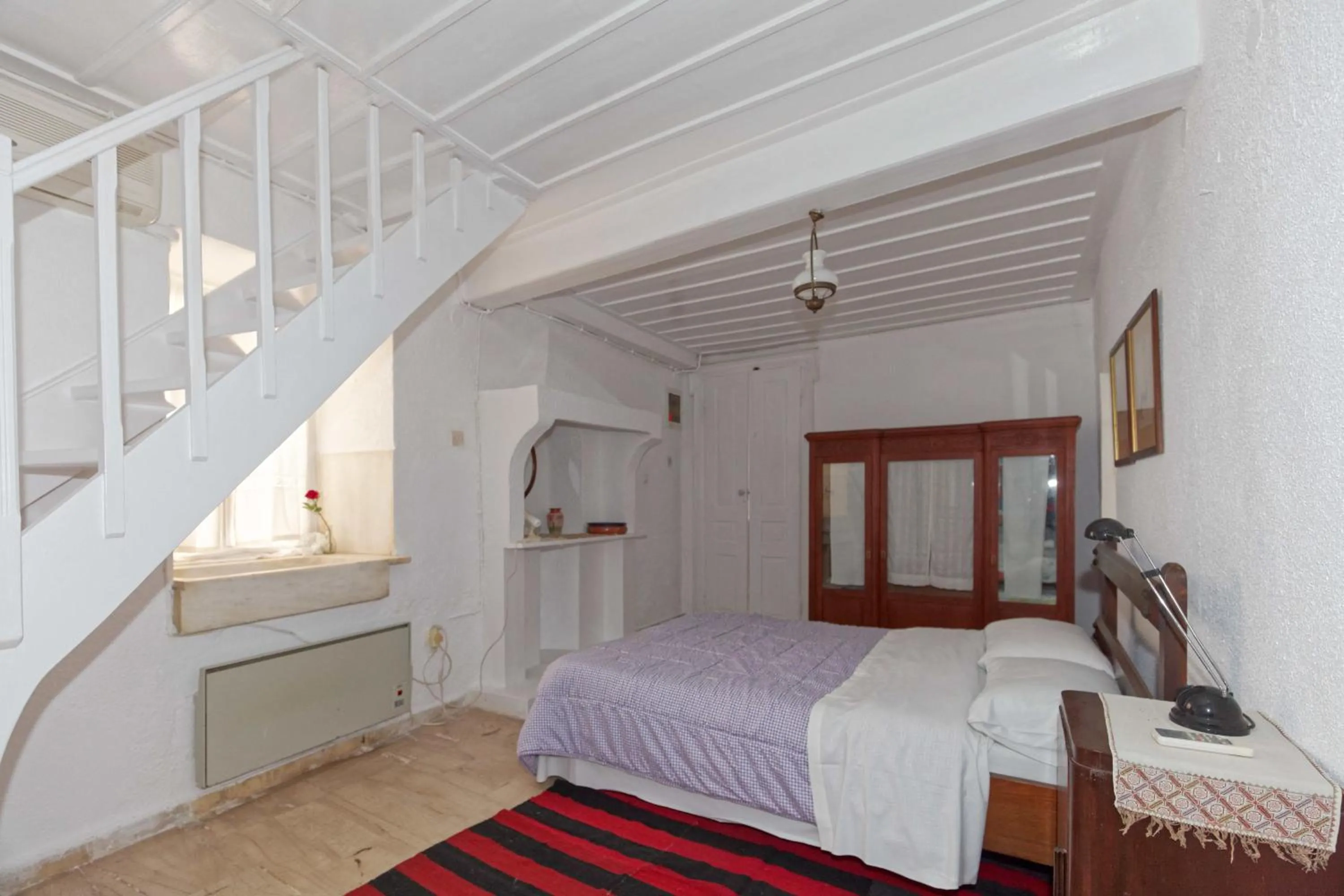 Bed in To Spitaki Apartments