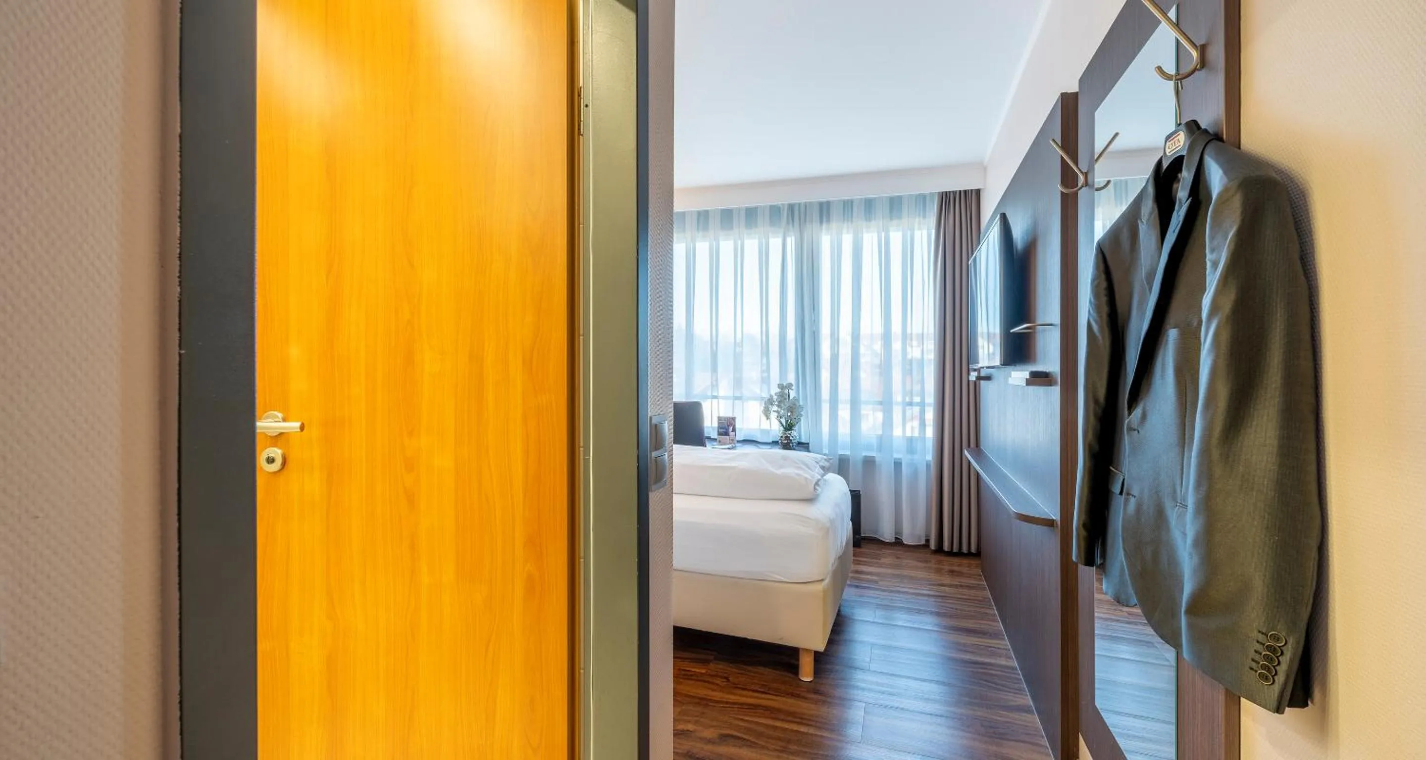 Photo of the whole room, Bed in PLAZA Hotel Föhr am Bodensee