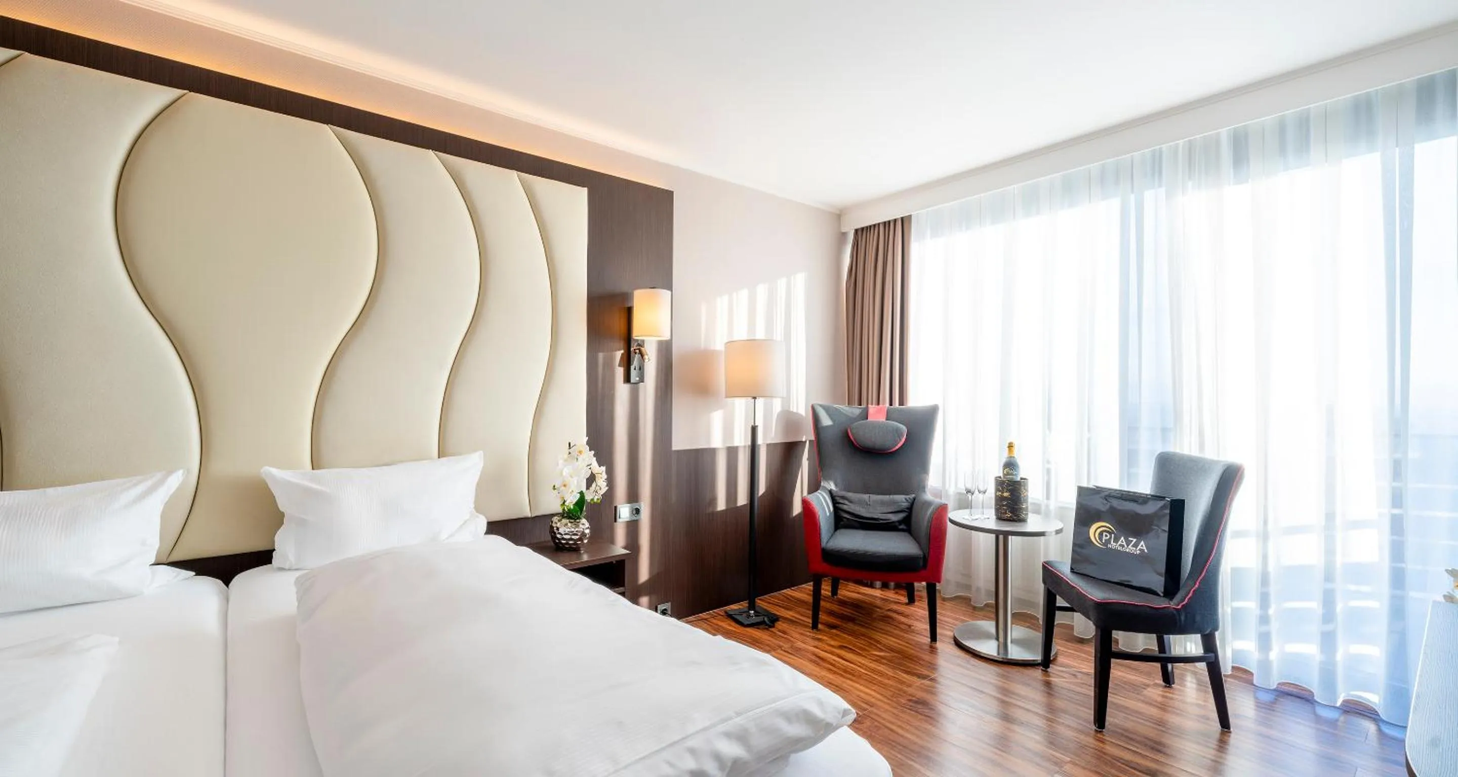 Photo of the whole room, Bed in PLAZA Hotel Föhr am Bodensee