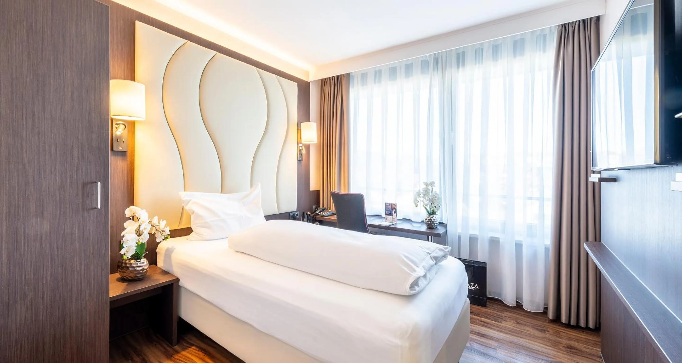 Bed in PLAZA Hotel Föhr am Bodensee