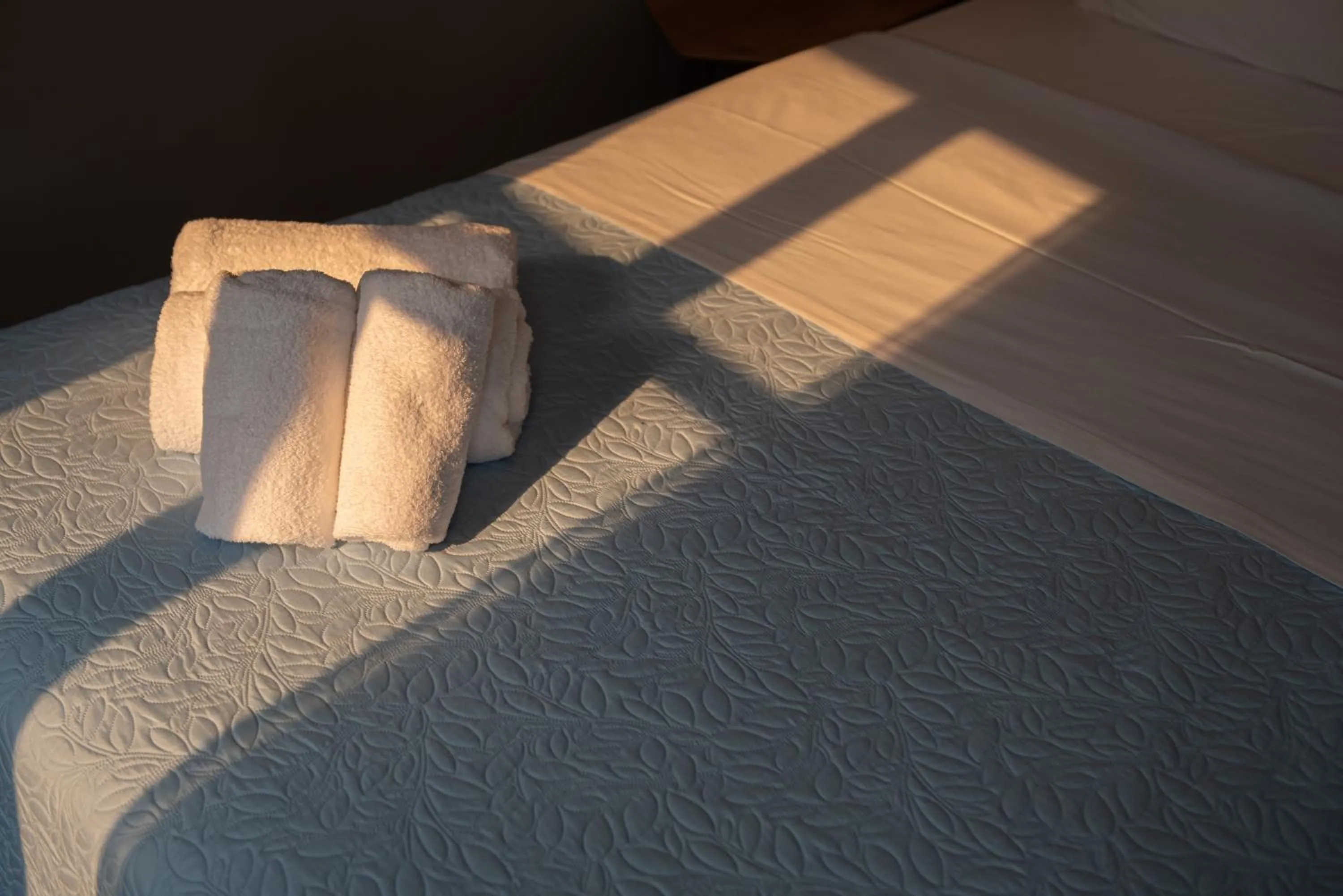 Bed in Beautiful City Suites