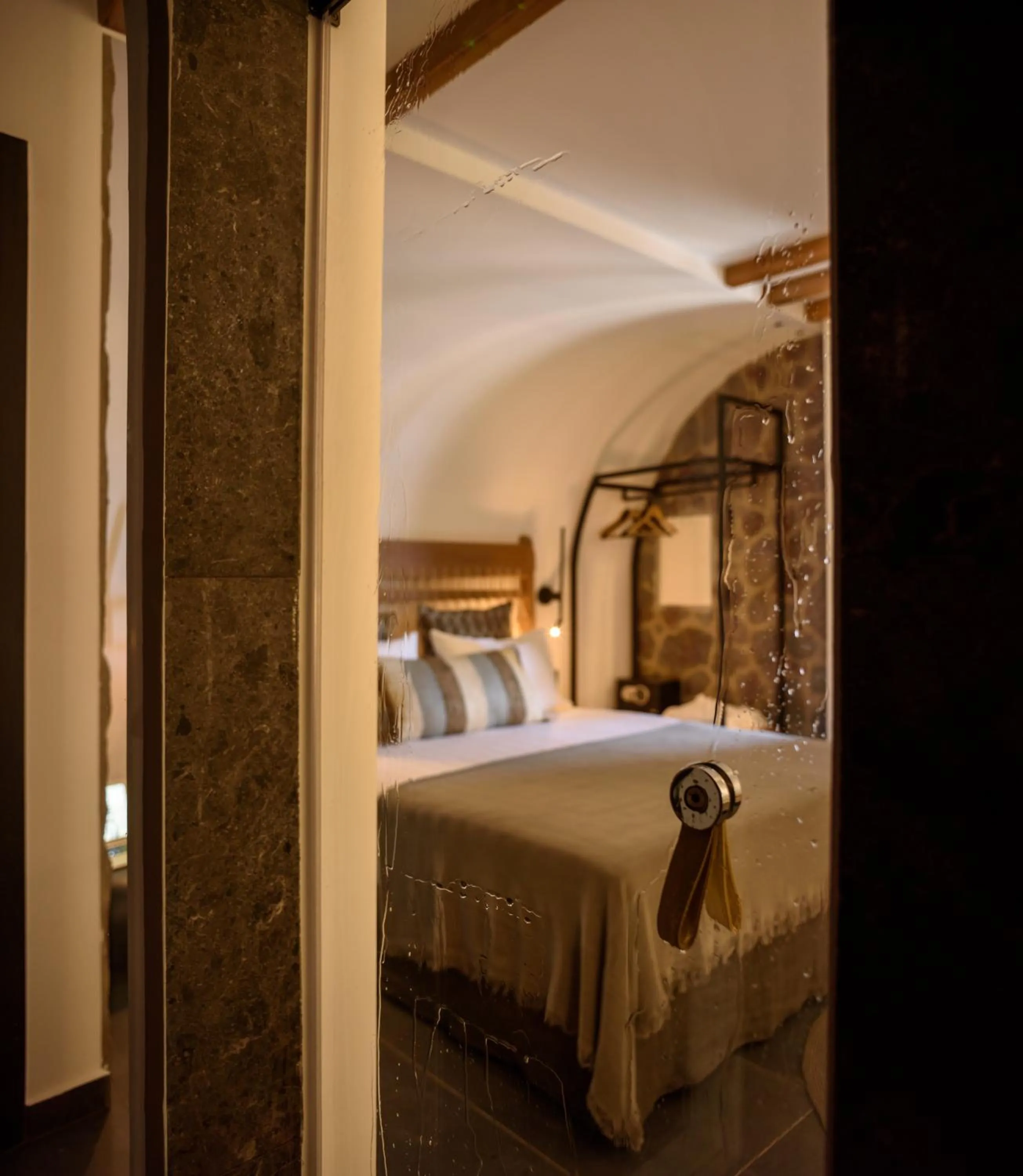 Bed in Vrachos Suites Mykonos