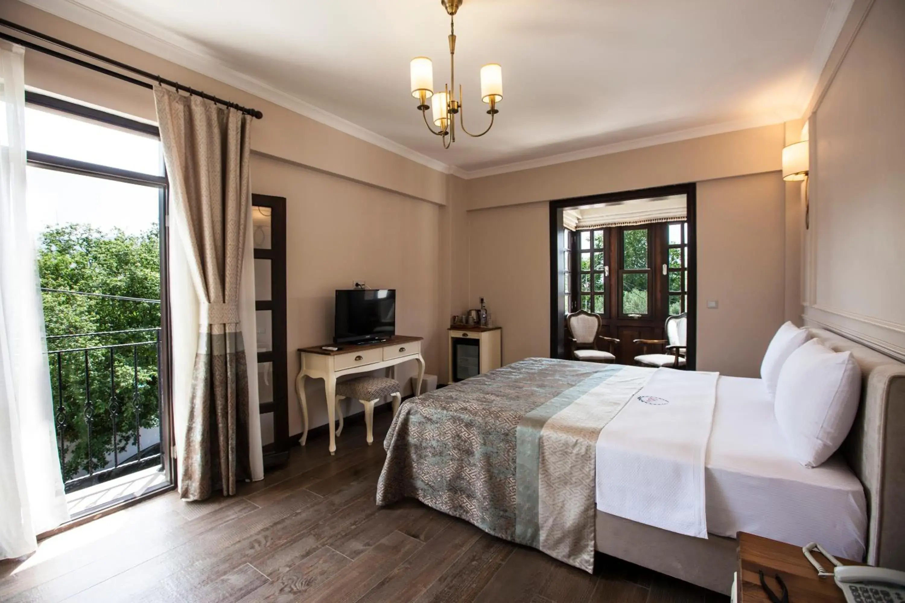 Communal lounge/ TV room, Bed in Livia Garden Hotel Communal lounge/ TV room, Bed in Livia Garden Hotel