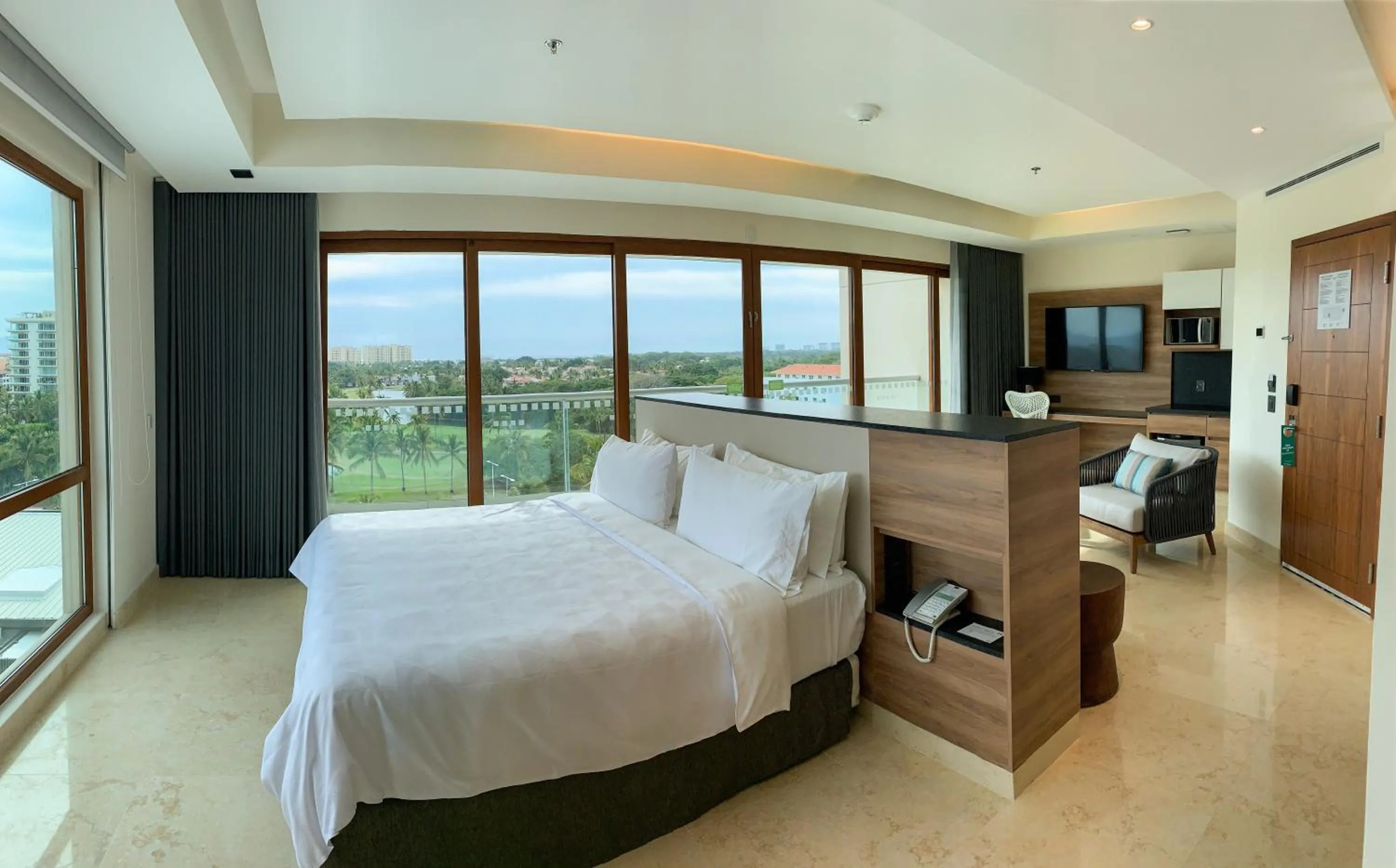 Photo of the whole room, Bed in Holiday Inn & Suites - Puerto Vallarta Marina & Golf by IHG