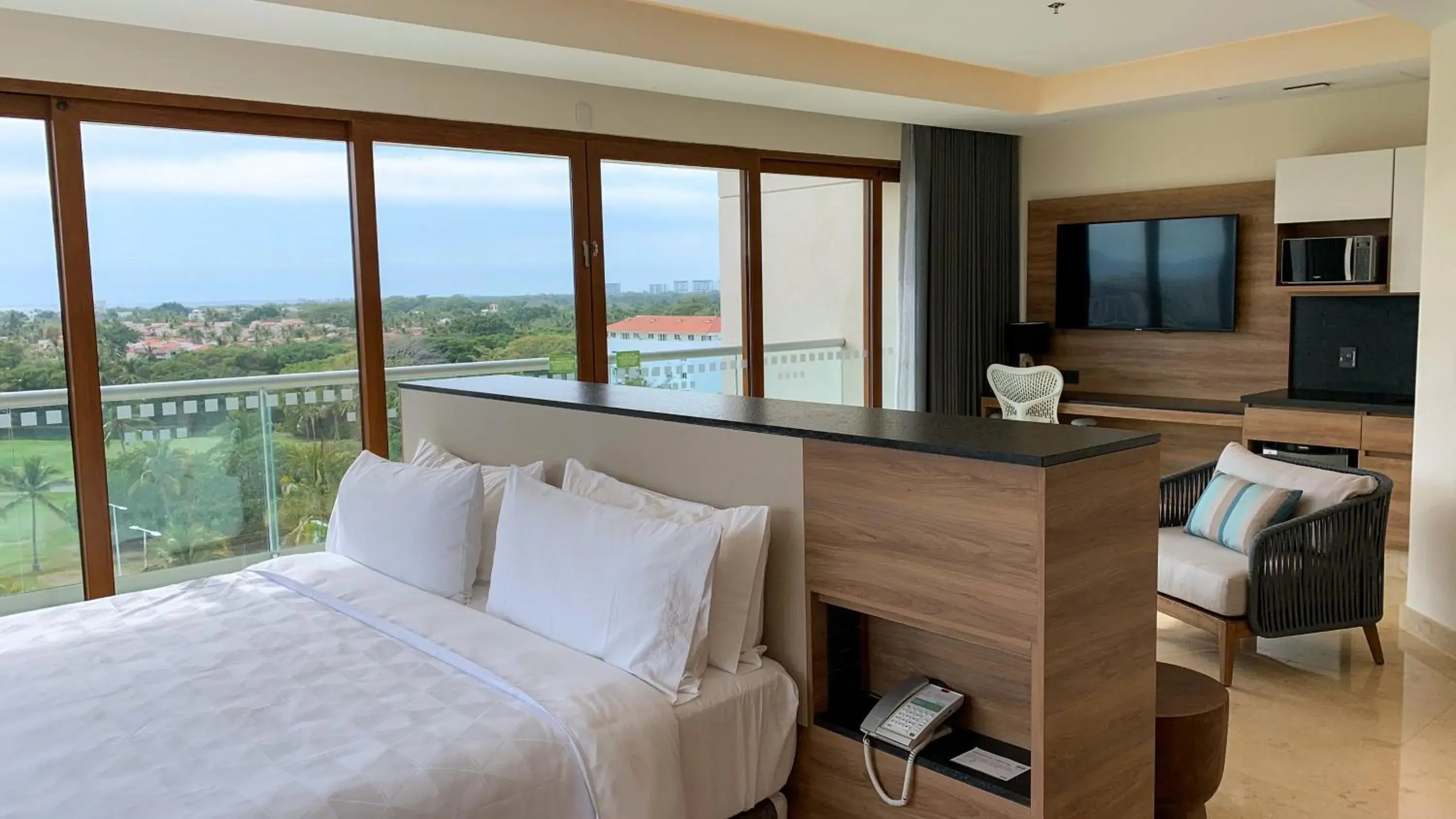 Photo of the whole room, Bed in Holiday Inn & Suites - Puerto Vallarta Marina & Golf by IHG Photo of the whole room, Bed in Holiday Inn & Suites - Puerto Vallarta Marina & Golf by IHG