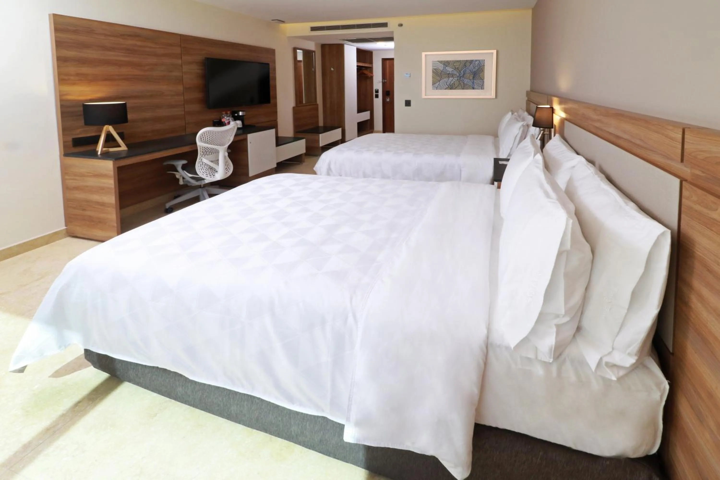 Photo of the whole room, Bed in Holiday Inn & Suites - Puerto Vallarta Marina & Golf by IHG