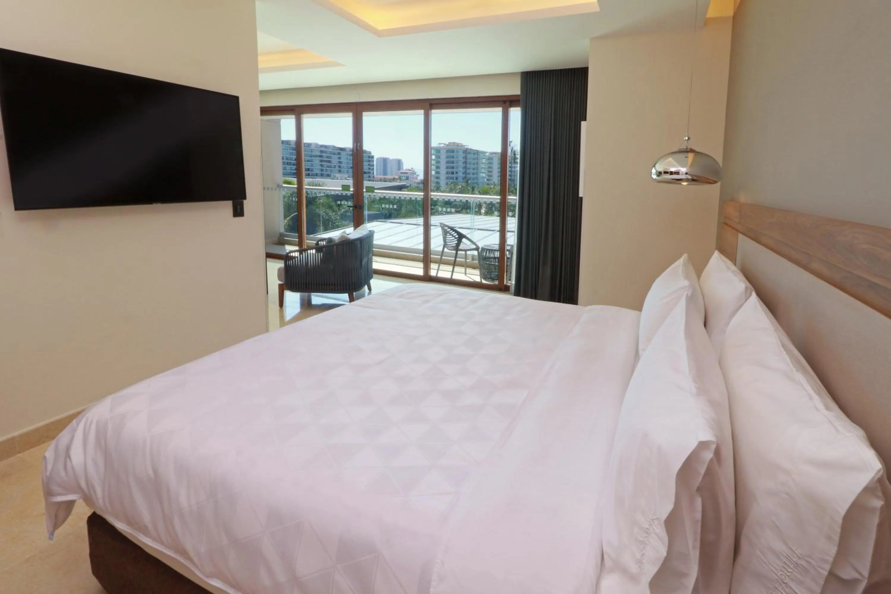 Photo of the whole room, Bed in Holiday Inn & Suites - Puerto Vallarta Marina & Golf by IHG