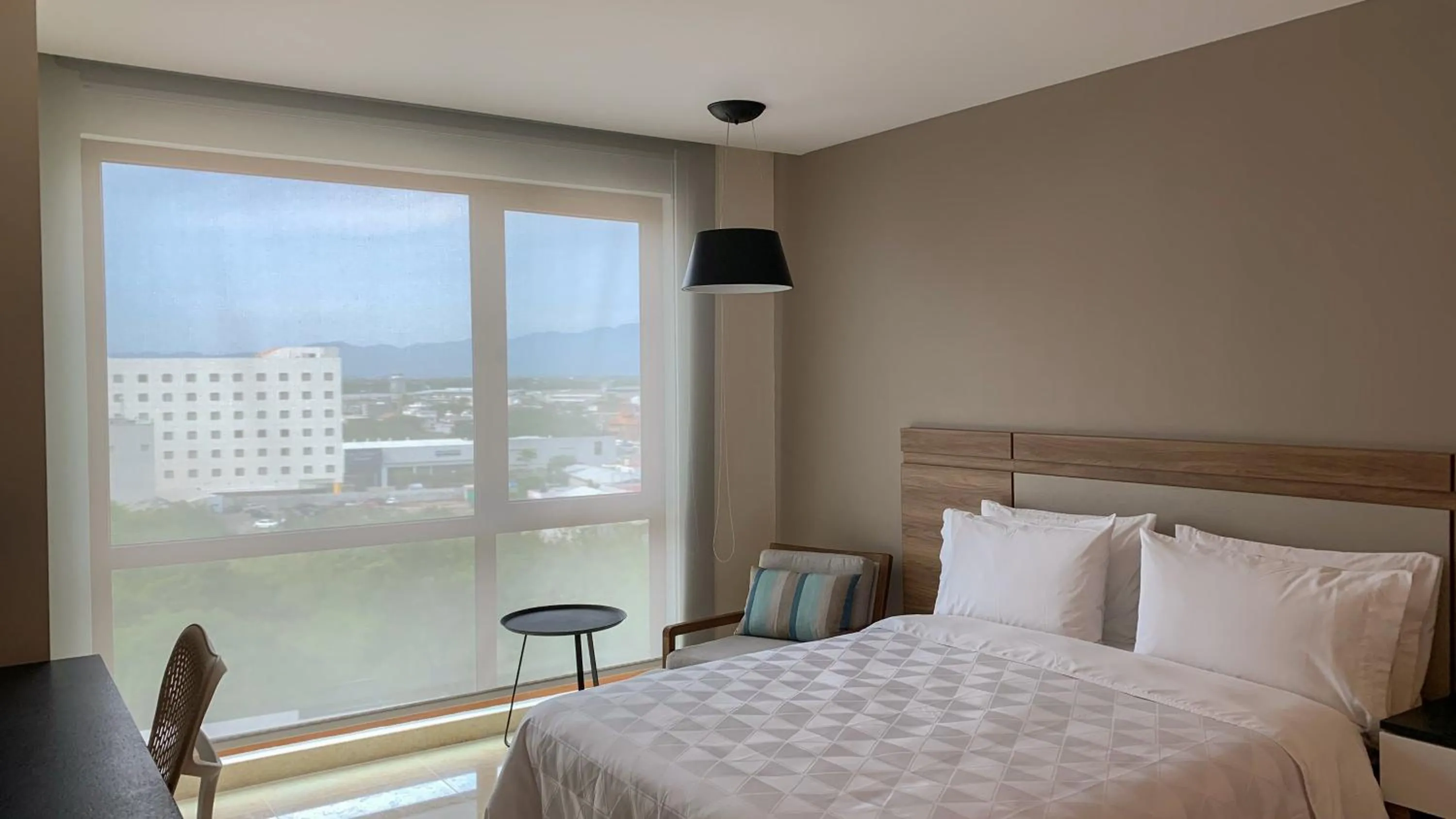 Photo of the whole room, Bed in Holiday Inn & Suites - Puerto Vallarta Marina & Golf by IHG