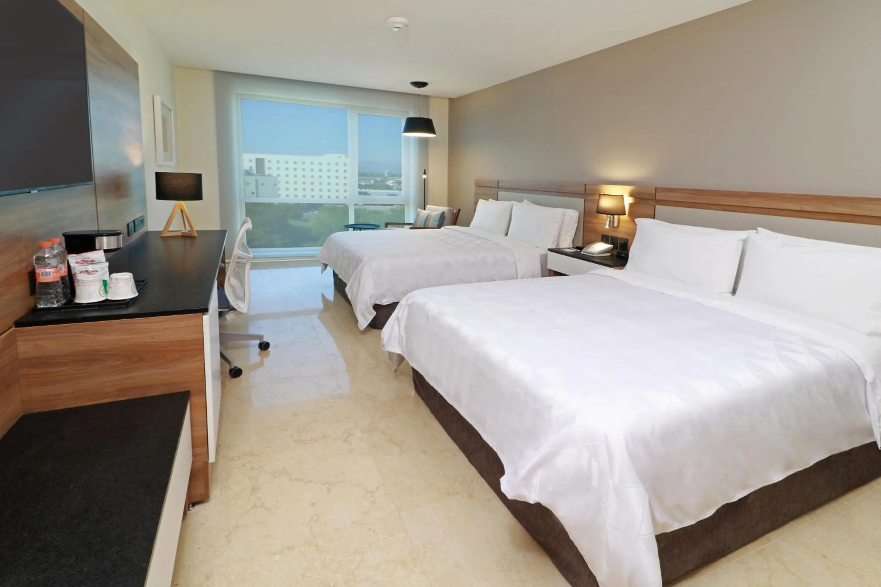 Photo of the whole room, Bed in Holiday Inn & Suites - Puerto Vallarta Marina & Golf by IHG