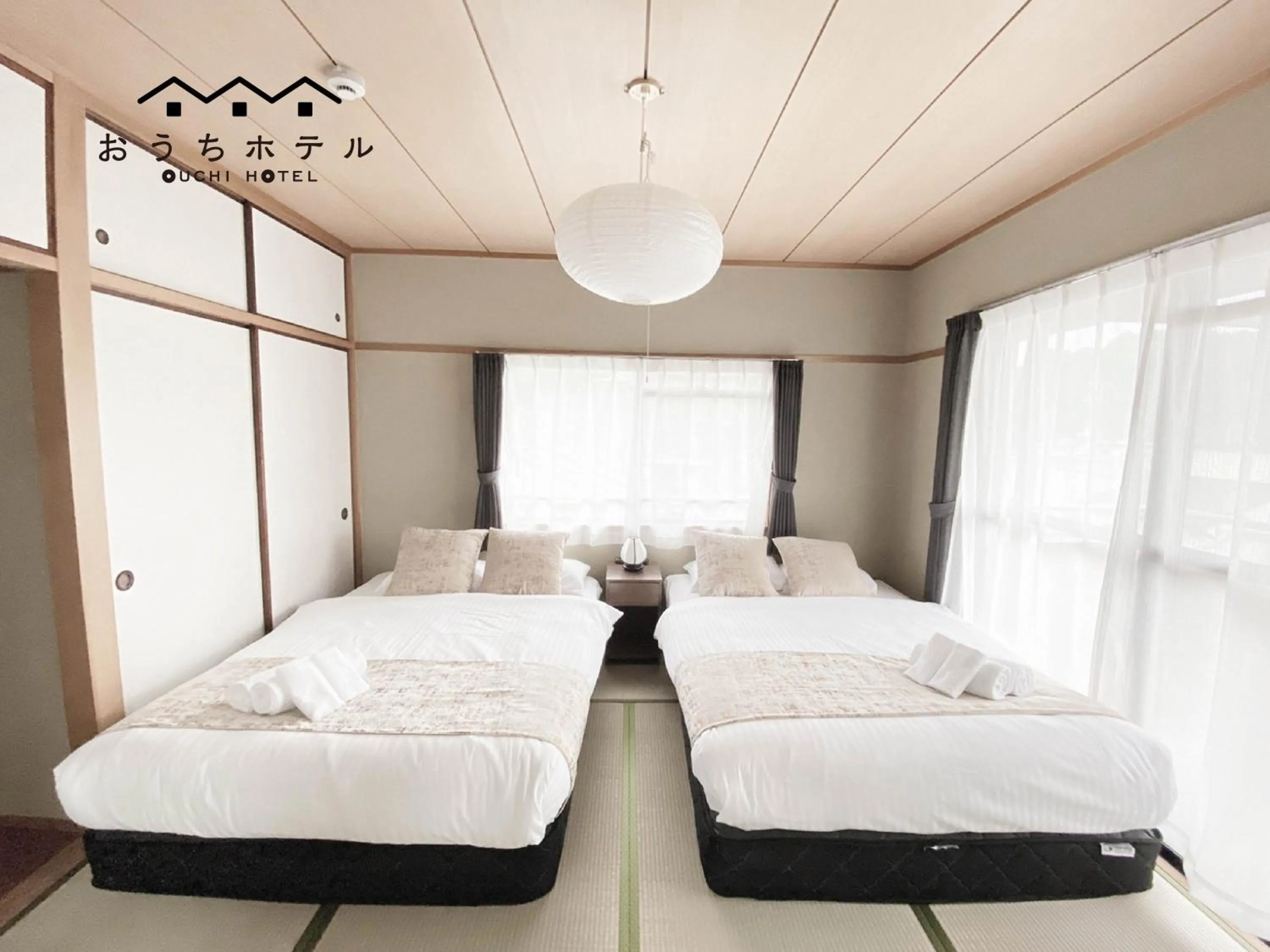 Bed in OUCHI HOTEL Itsukaichi