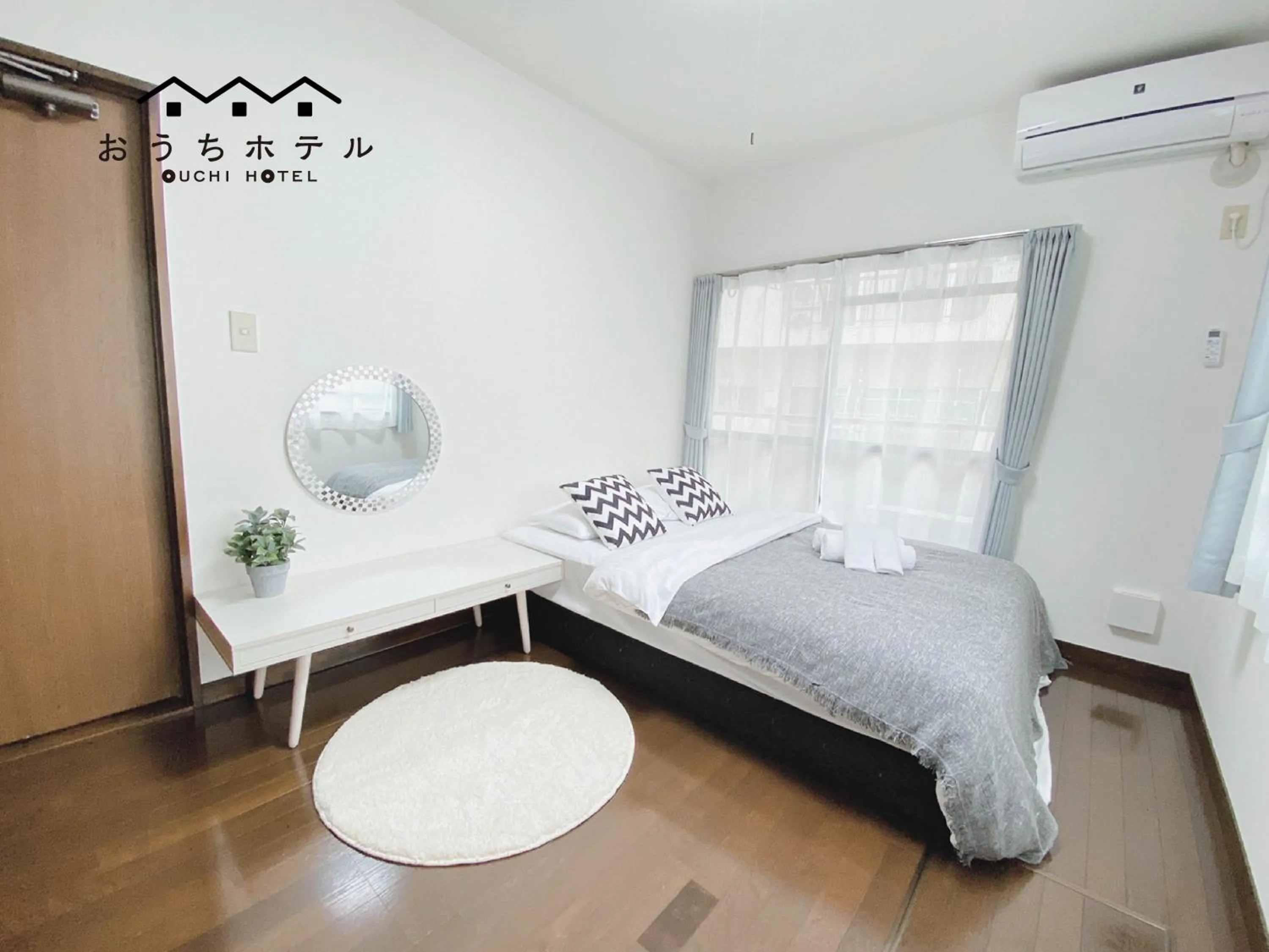 Bed in OUCHI HOTEL Itsukaichi