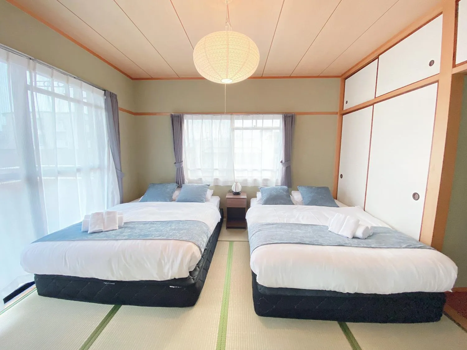Bed in OUCHI HOTEL Itsukaichi