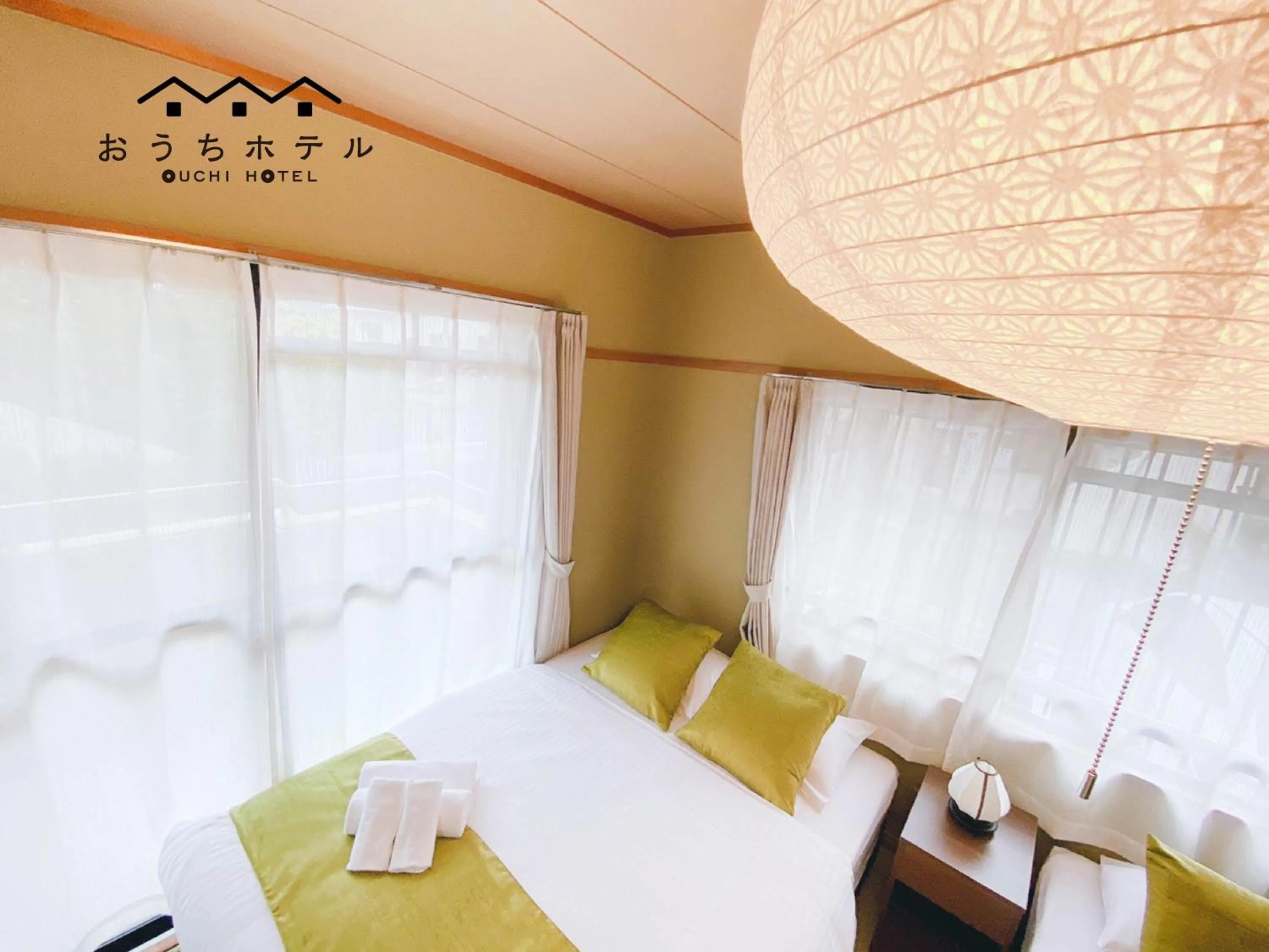 Bed in OUCHI HOTEL Itsukaichi