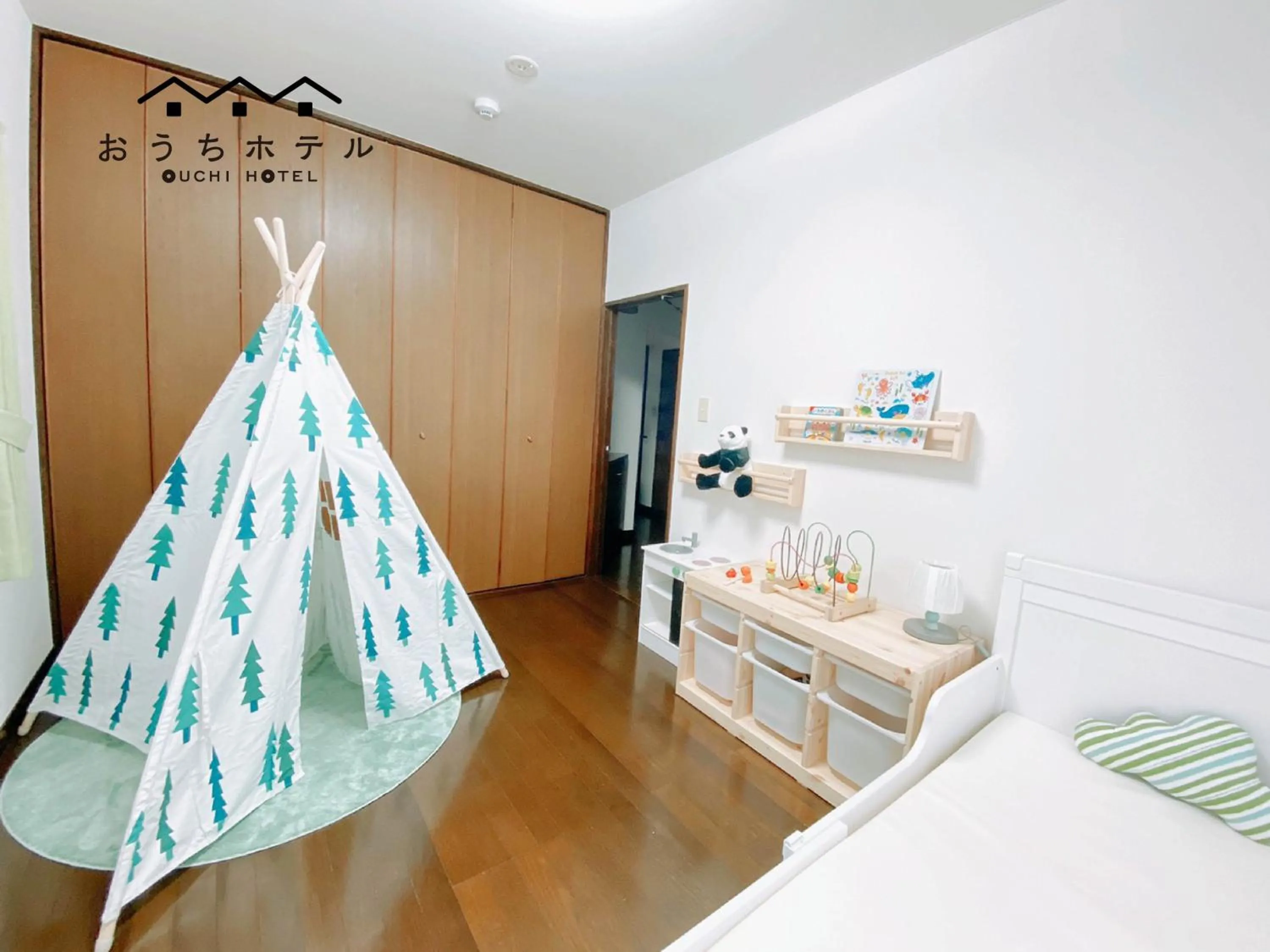 Bed in OUCHI HOTEL Itsukaichi