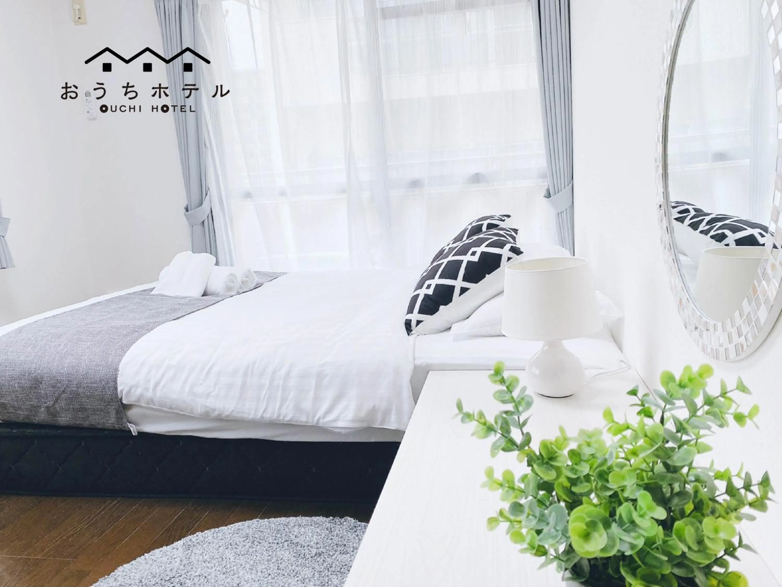 Bed in OUCHI HOTEL Itsukaichi