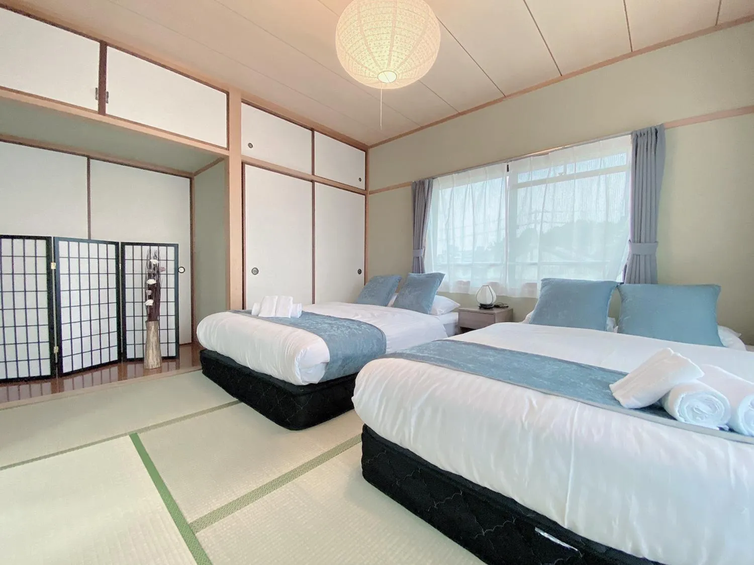 Bed in OUCHI HOTEL Itsukaichi