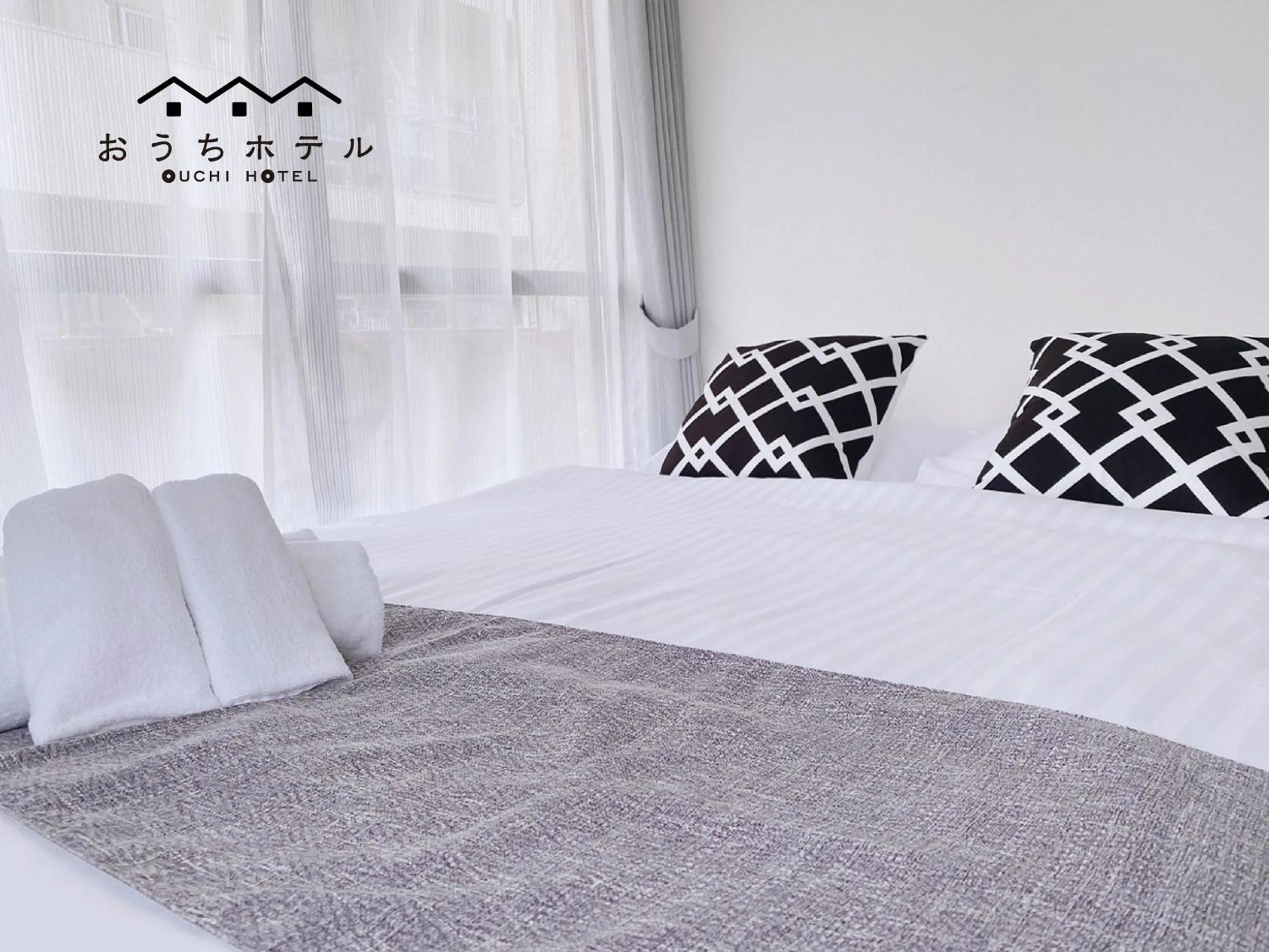 Bed in OUCHI HOTEL Itsukaichi