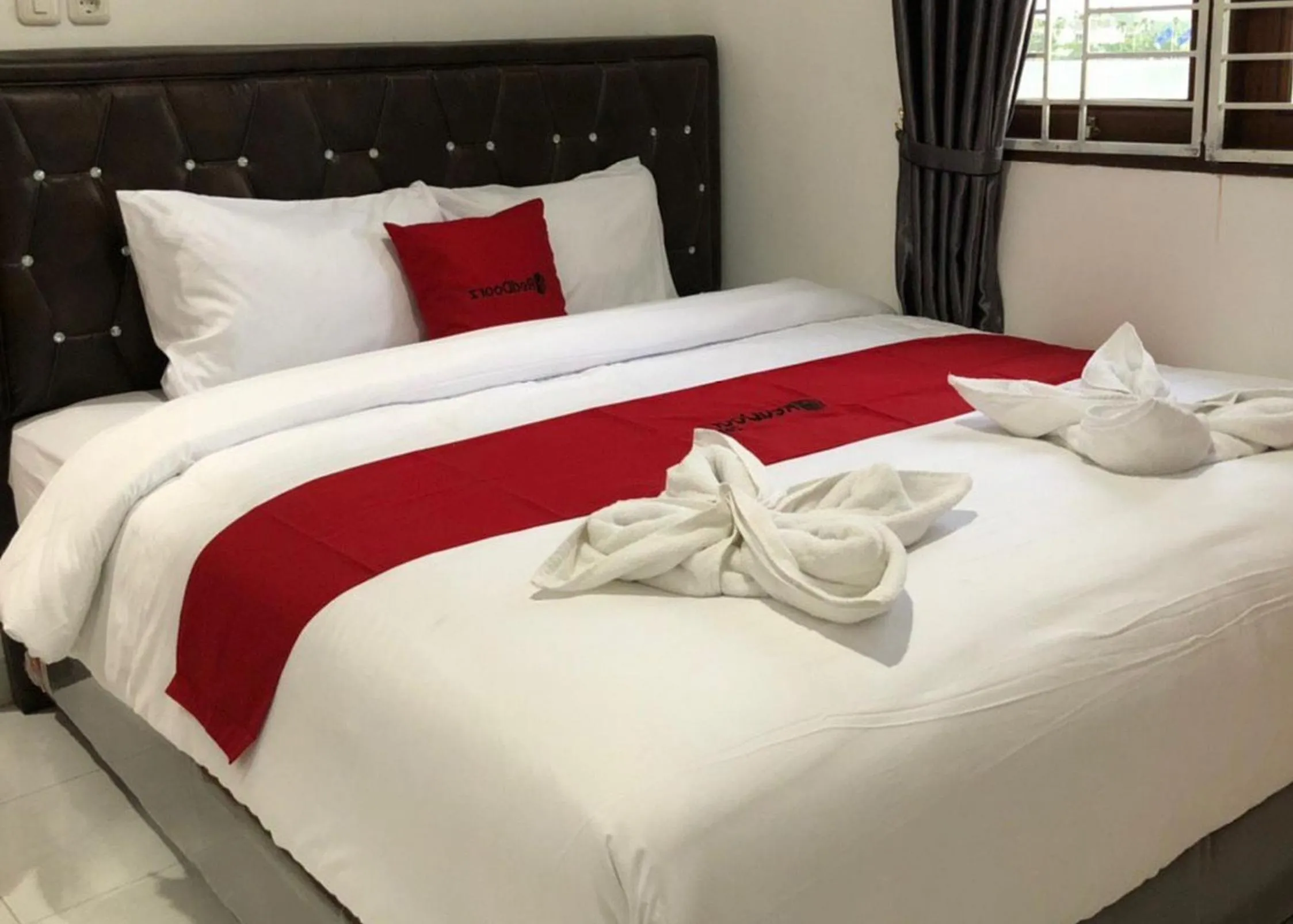 Bed in RedDoorz near CitraLand Gama City Medan