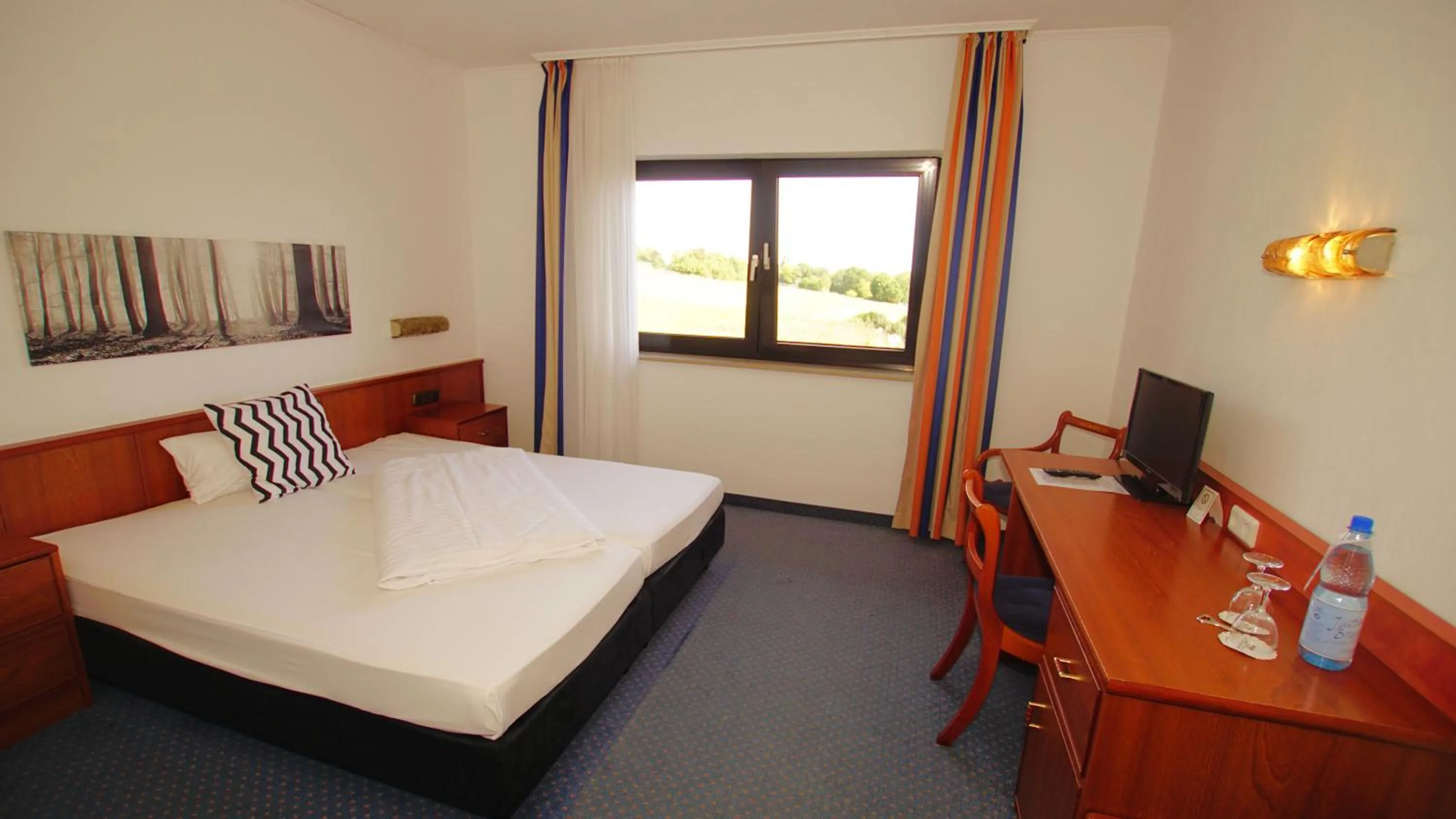 Photo of the whole room, Bed in Hotel Tannenhof Haiger